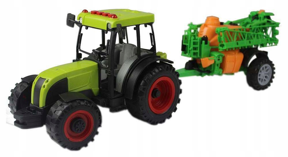 

Traktor z maszyną rolniczą z opryskiwaczem zielony