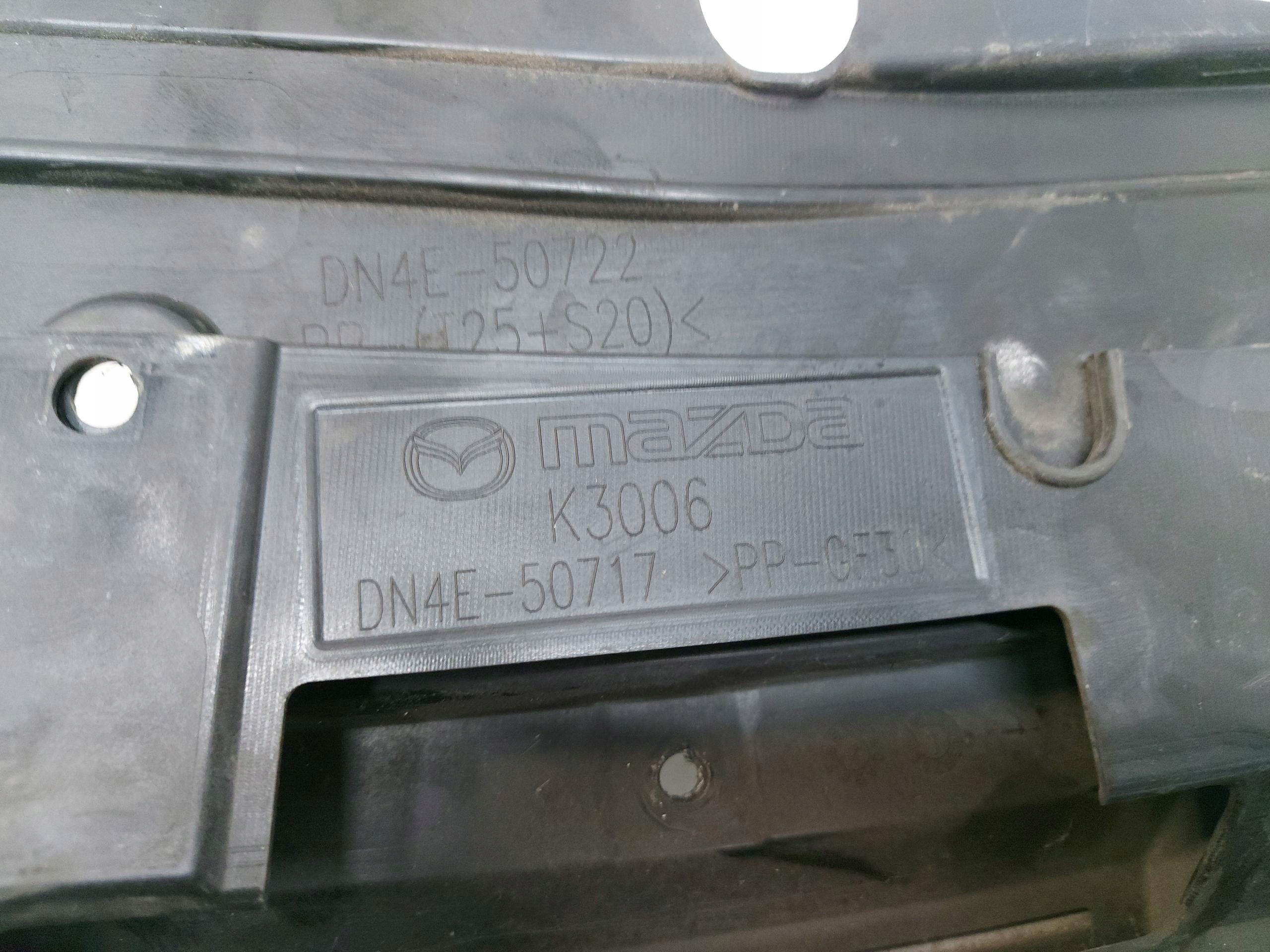 Mazda MX-30 EL cover cap upper visor of a bumper front damaged.