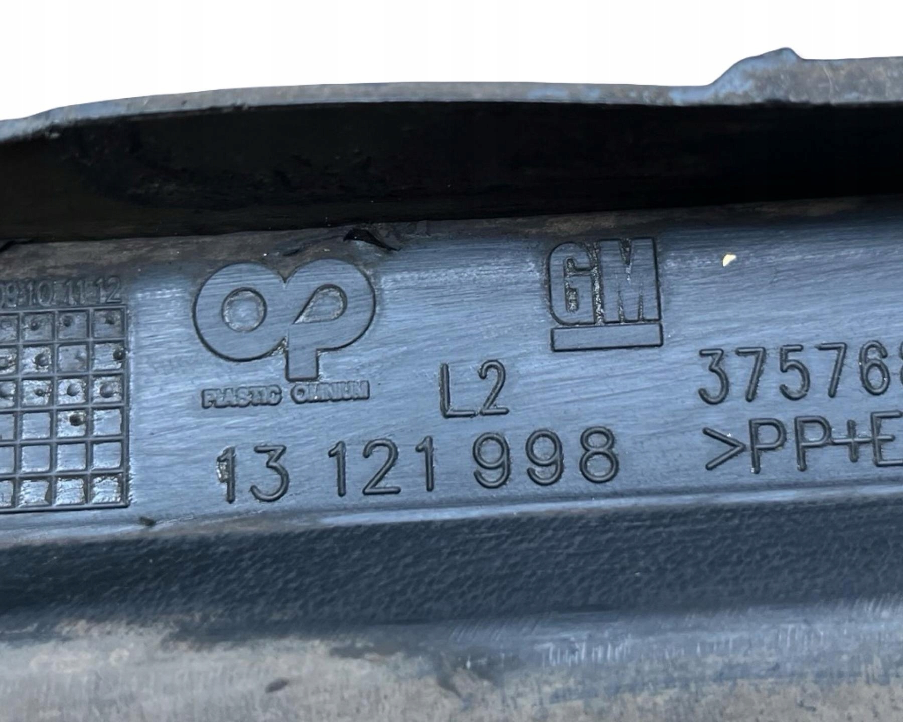 spoiler of a bumper front left side Opel Astra H facelift 2006 13121998