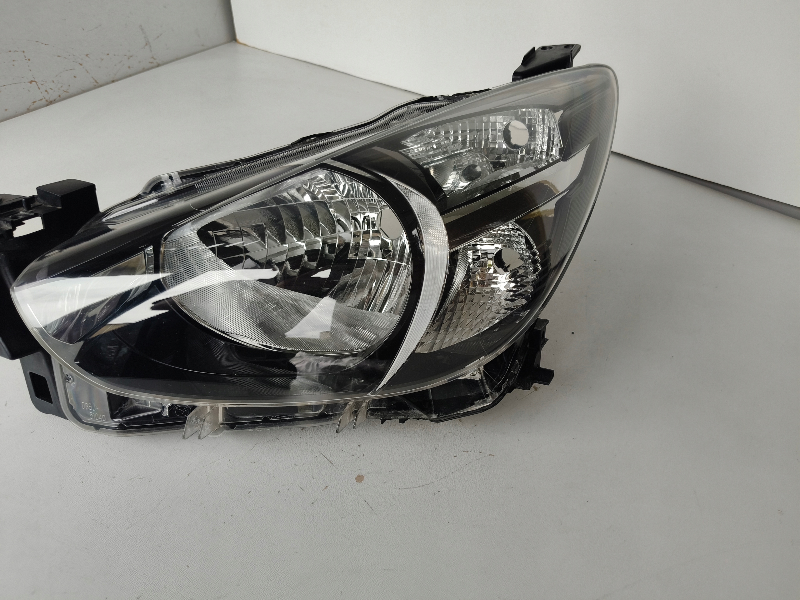 light left REFLEKTOR MAZDA 2 14