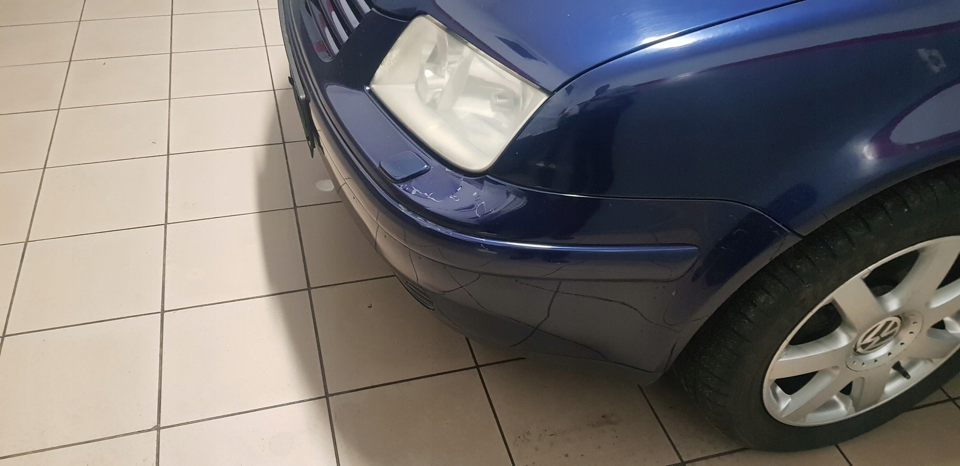 VW BORA SPRYSKIWACZ LAMPY PRZOD PRAWY LEWY
