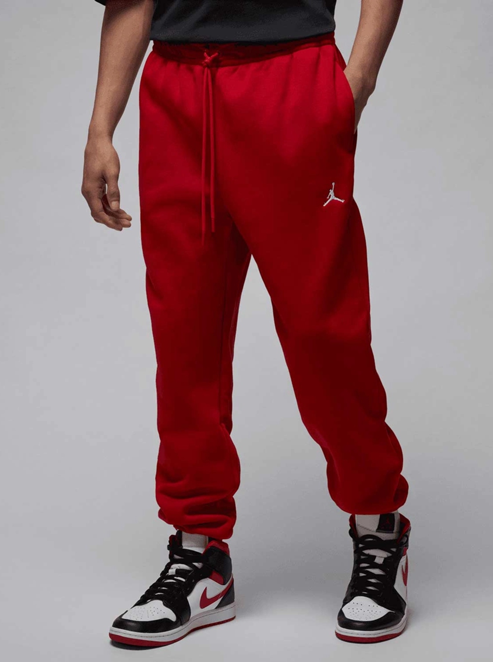 Pánské červené teplákové kalhoty Jordan Jumpman Fleece IM9793-687 vel. S