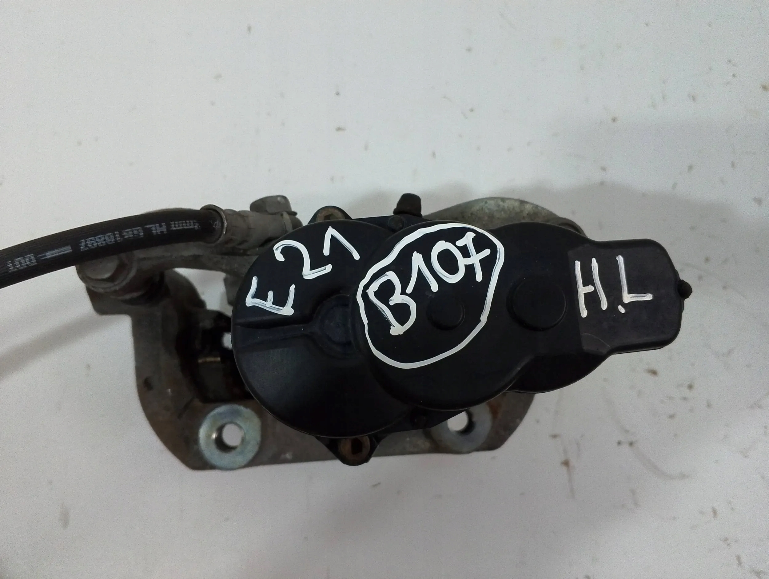 Toyota Corolla E210 E21 caliper rear left (B107)