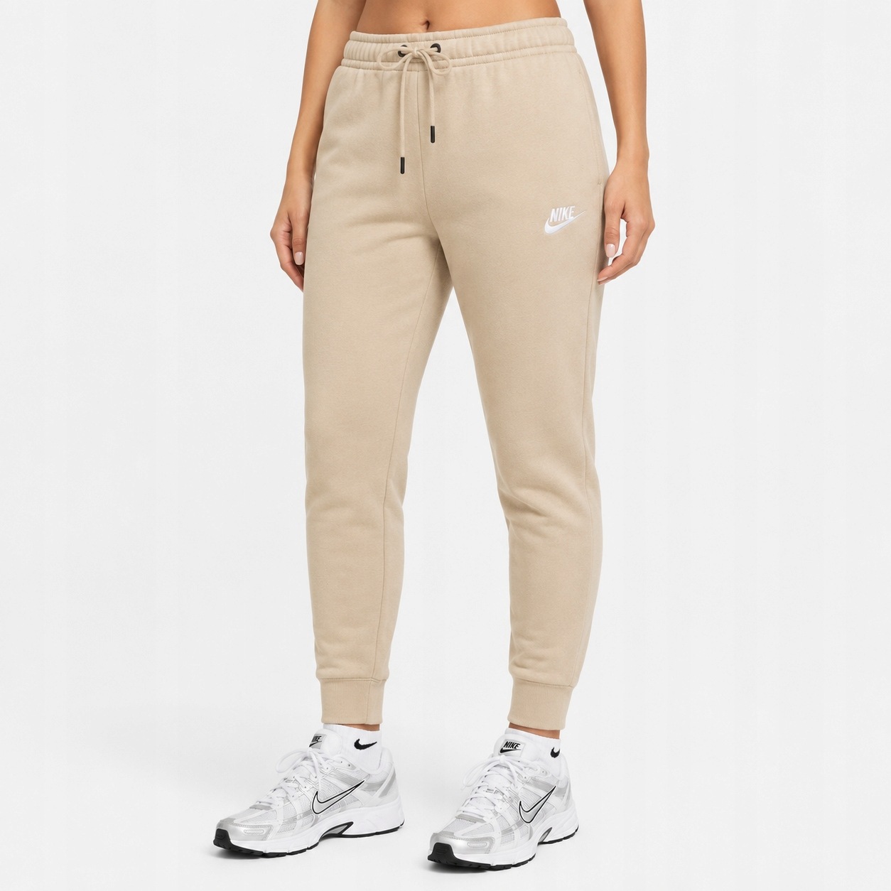 Spodnie dresowe damskie Nike Sportswear Fleece Beżowe BV4095-126 r. Xs