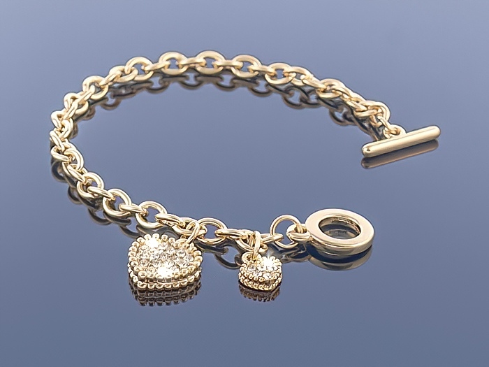 

Złota bransoletka Charms
