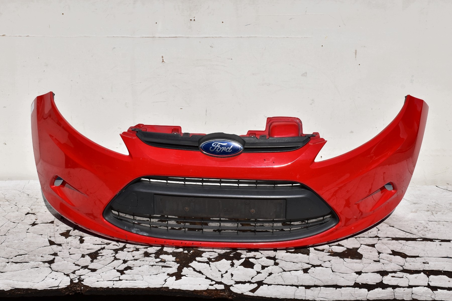 bumper front FORD FIESTA MK7 pre facelift 2008-2012 code lakieru: Colorado Red