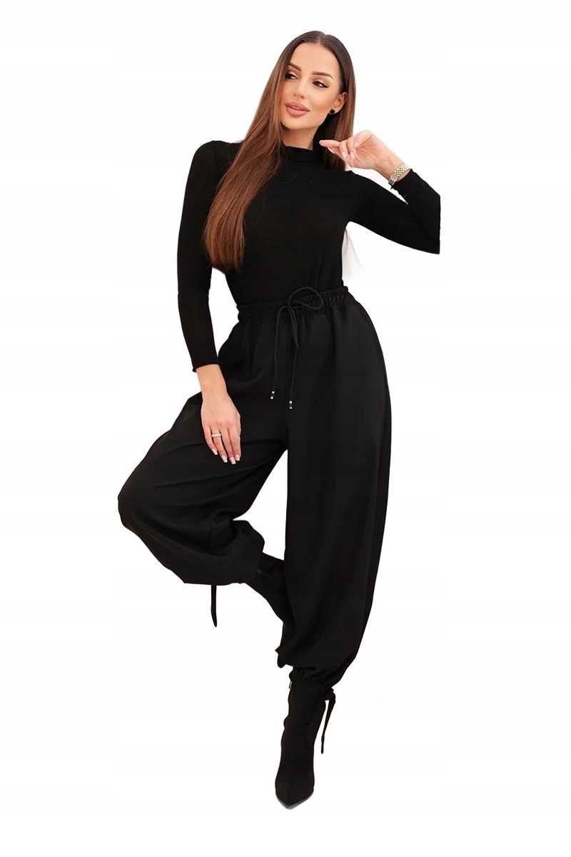 Czarne spodnie damskie z szeroką nogawką i wiązaniem u dołu