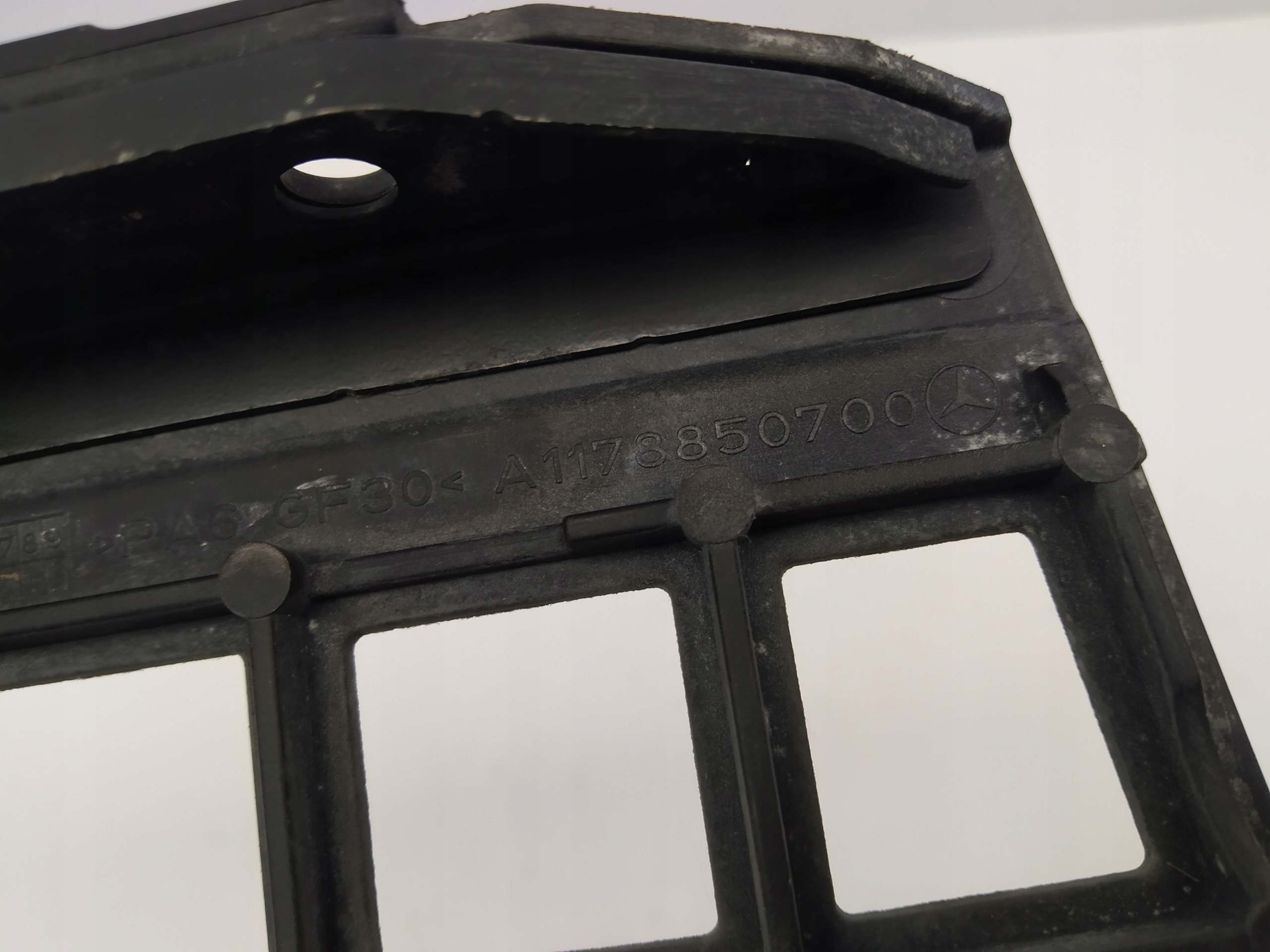 W117 Mercedes CLA support holder of a bumper front left A1178850700