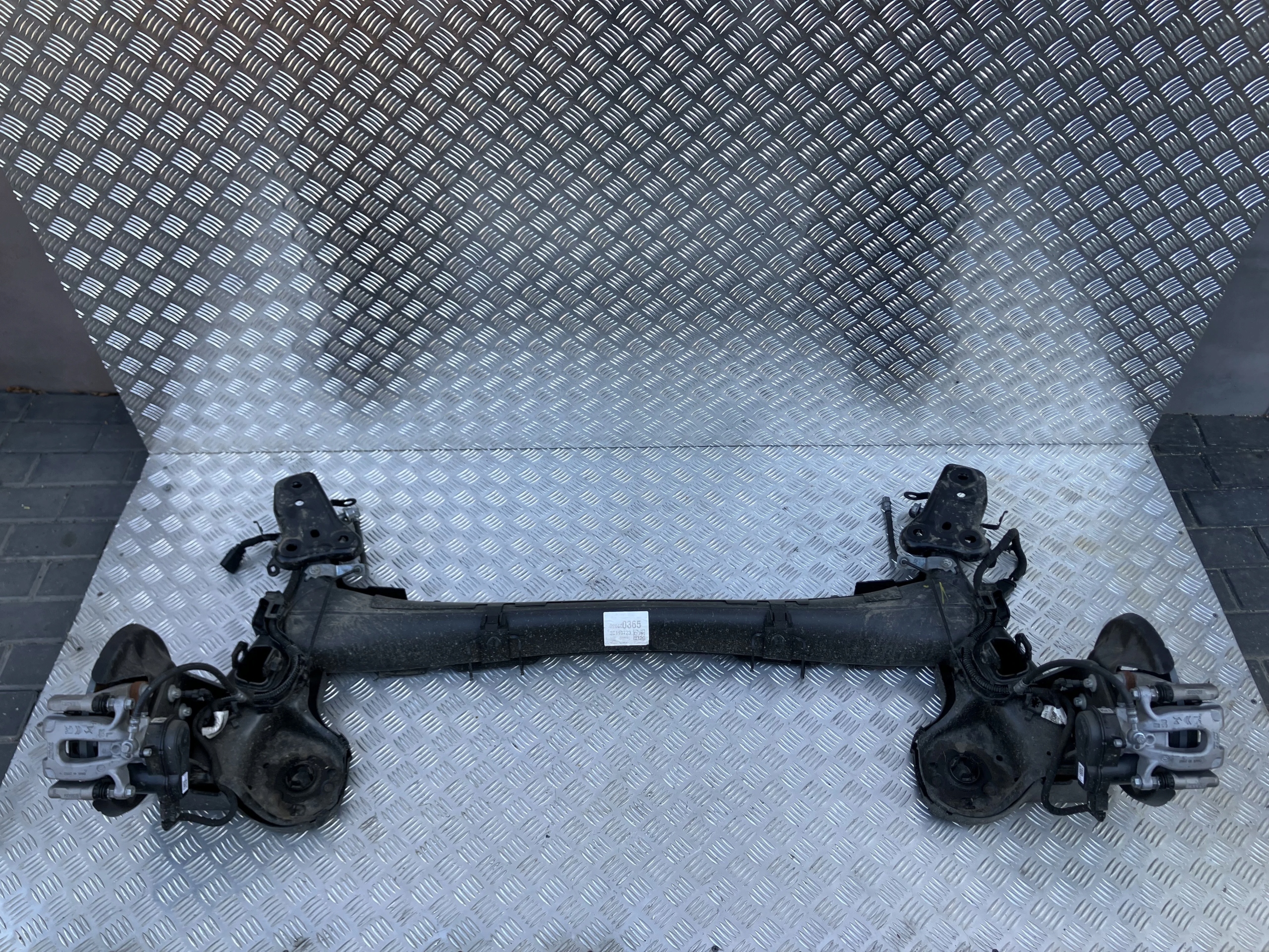 BELKA ZAWIESZENIA TYŁ OŚ TARCZE OPEL CORSA F 19-