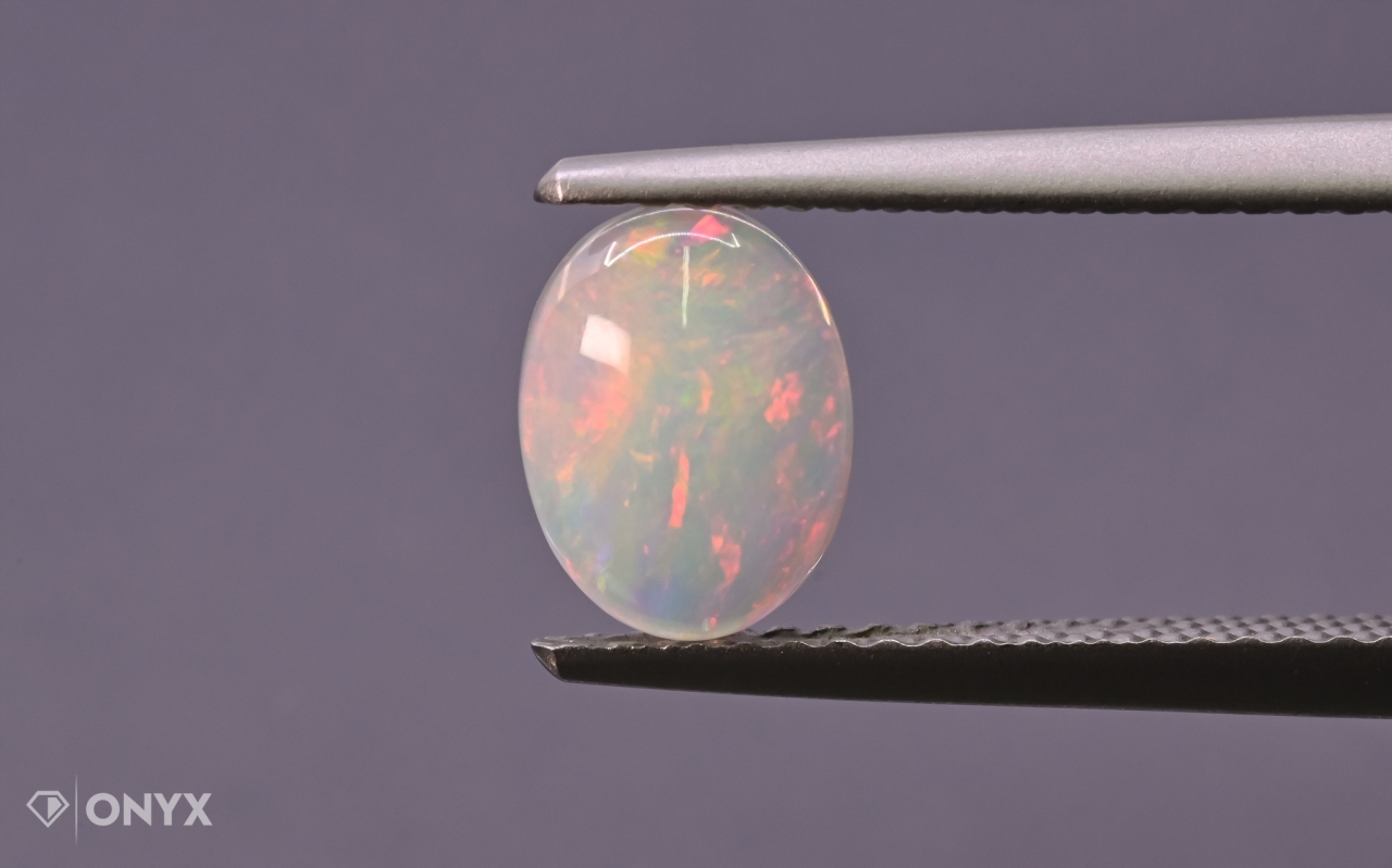 Opál z Etiopie kabošon ovál 8x6 mm