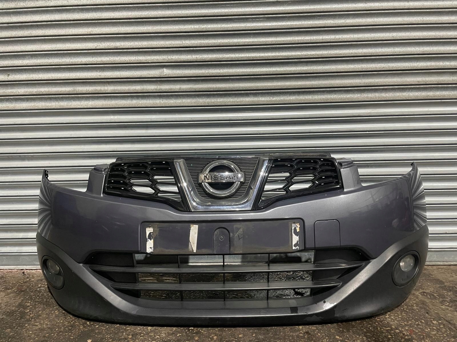 KOMPLETNY NISSAN QASHQAI J10 LIFT B52G MASKA ZDERZAK BŁOTNIK Producent części Nissan OE