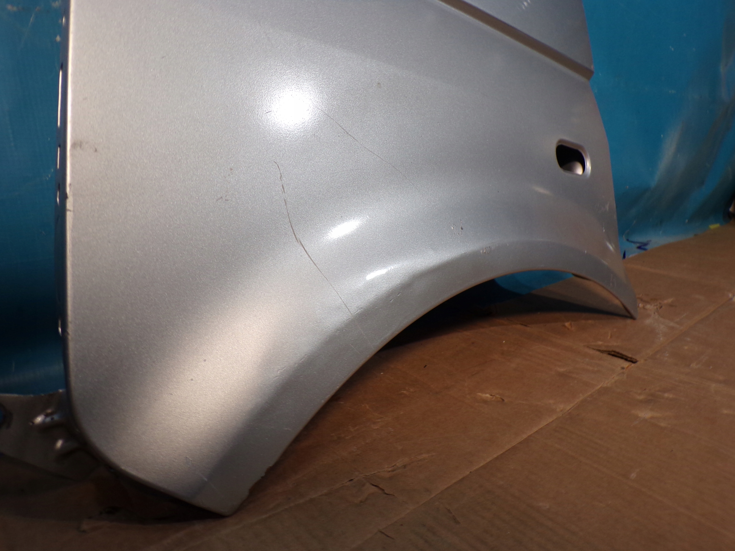 VW T5 TRANSPORTER MULTIVAN 03- fender left SREBRNY without RDZY