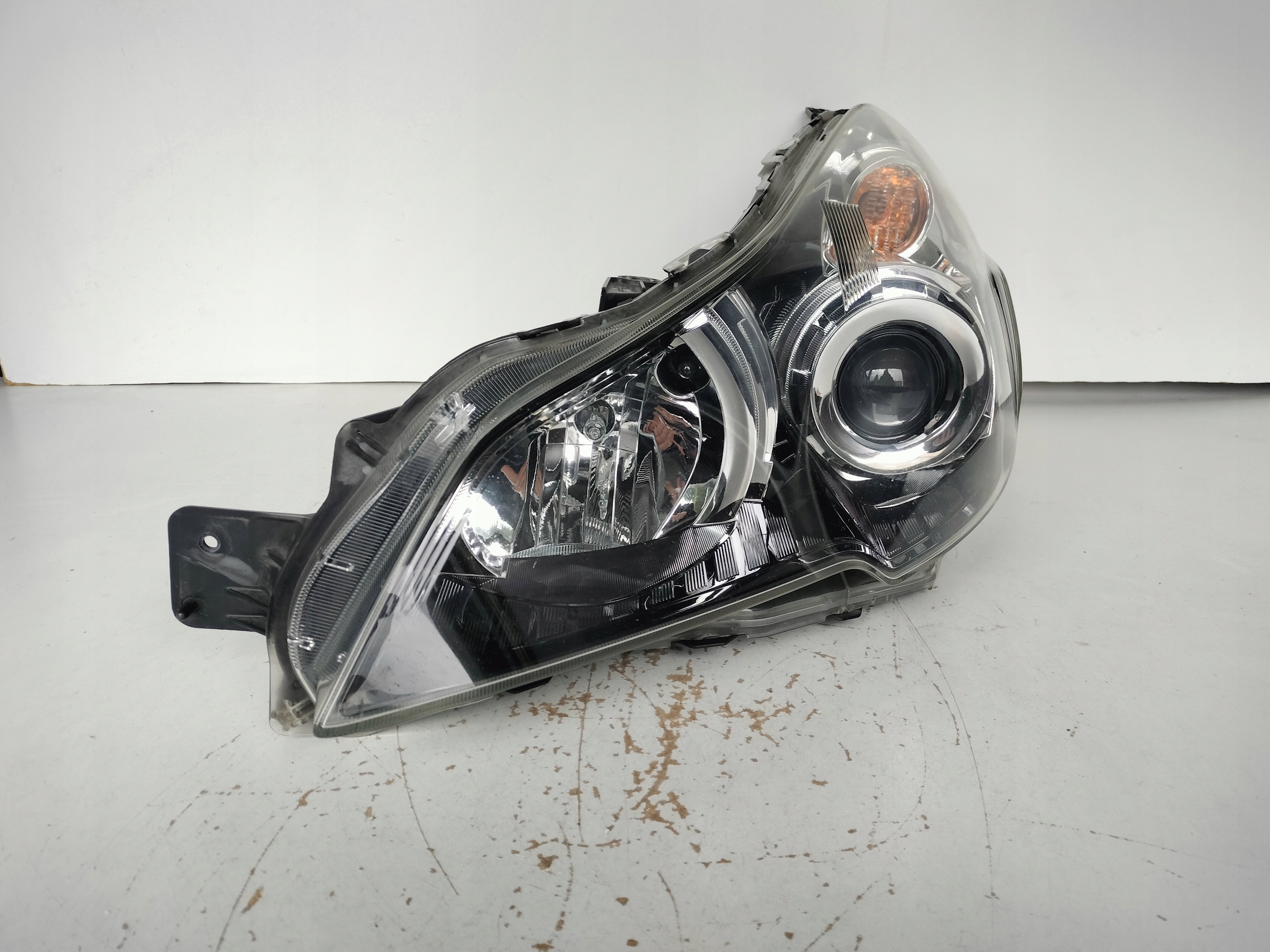 light left REFLEKTOR SUBARU OUTBACK 09- XENON black