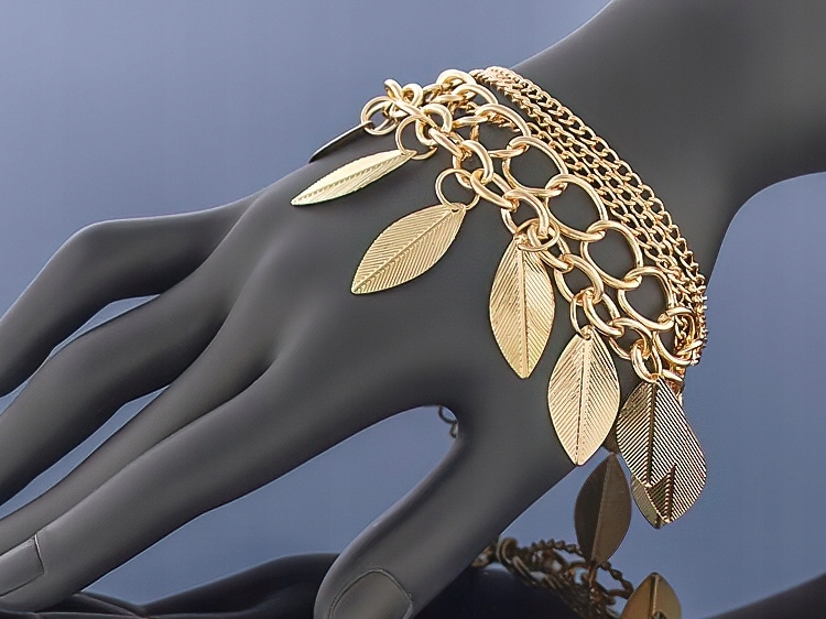 

Złota bransoletka Charms