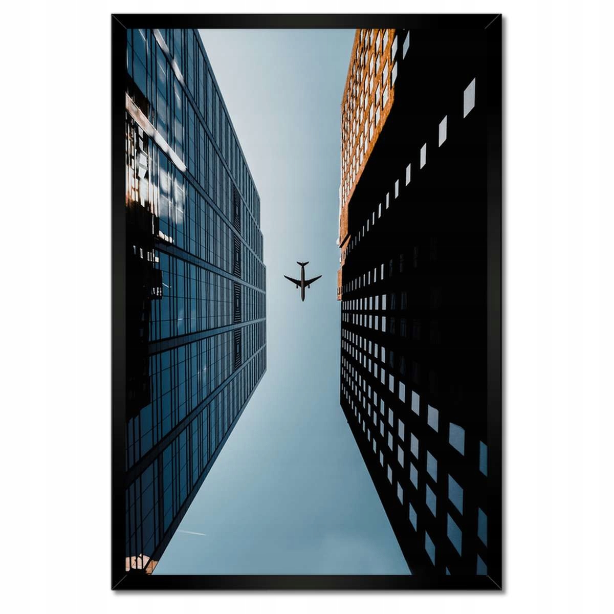 Plakáty v rámu 40x60 Letadlo mezi budovami