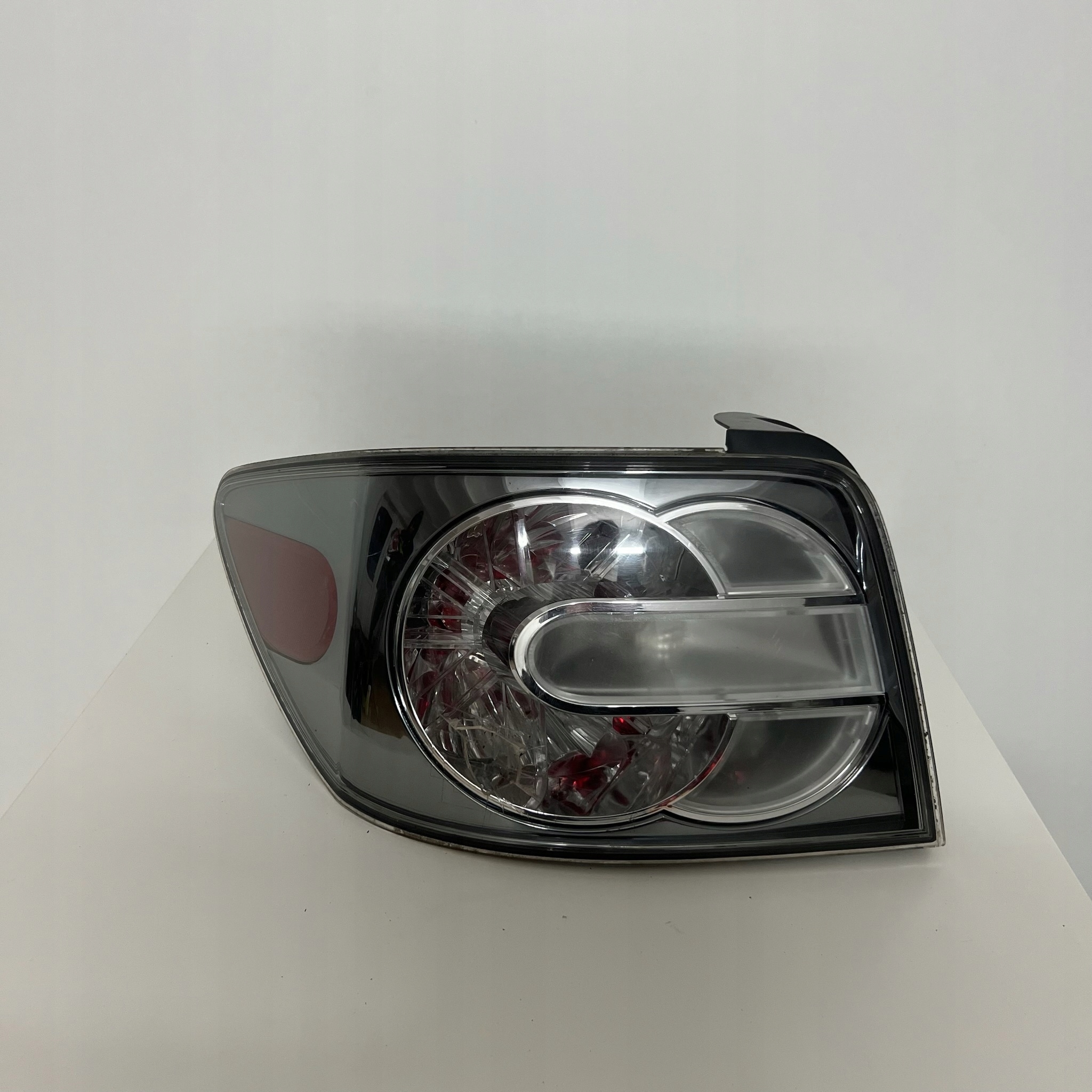 LAMPA LEWY TYŁ LEWA TYLNIA MAZDA CX-7 EG21-51150