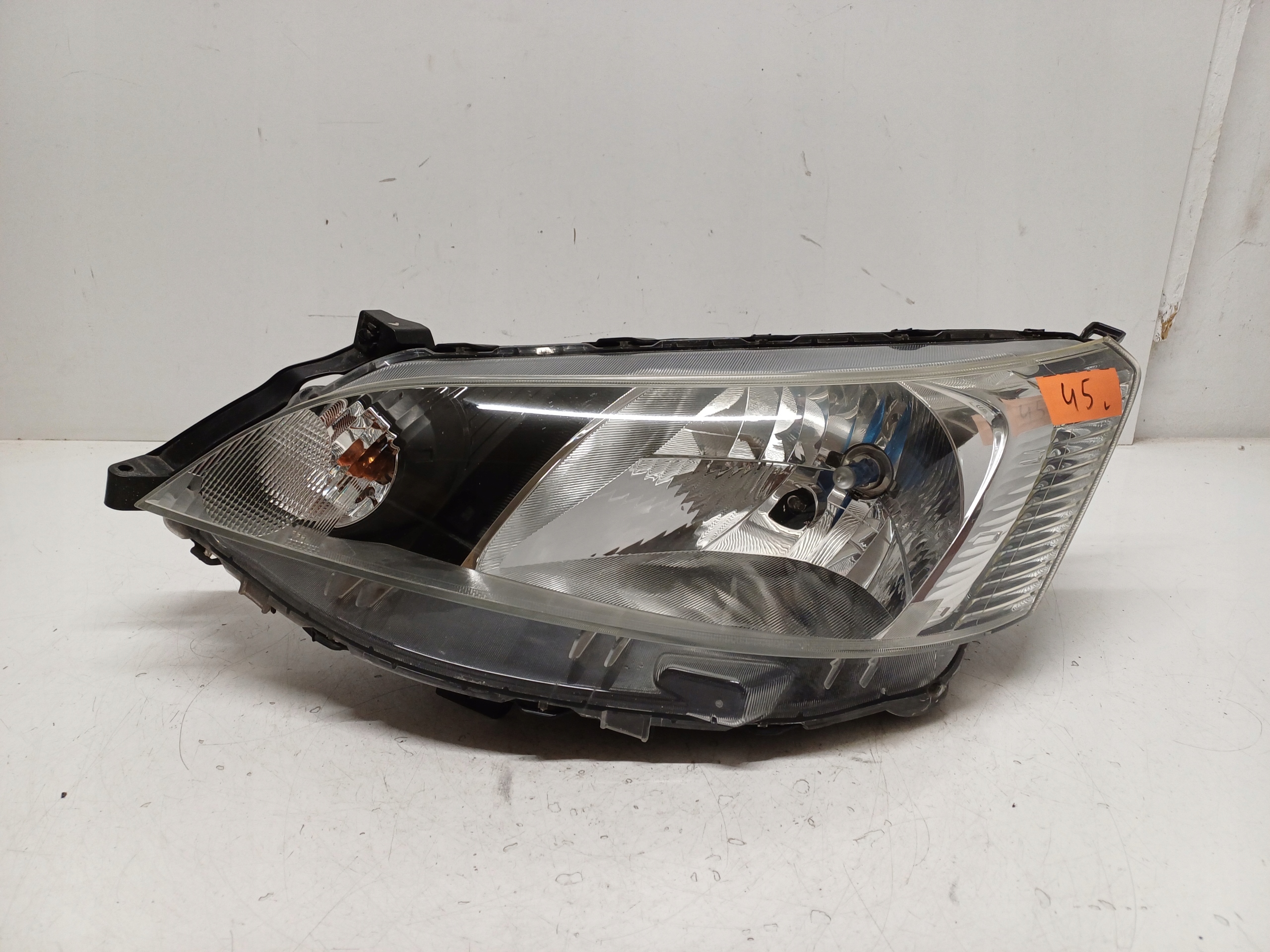 NISSAN Nv200 09- ФАРА ЛІВА ПЕРЕД