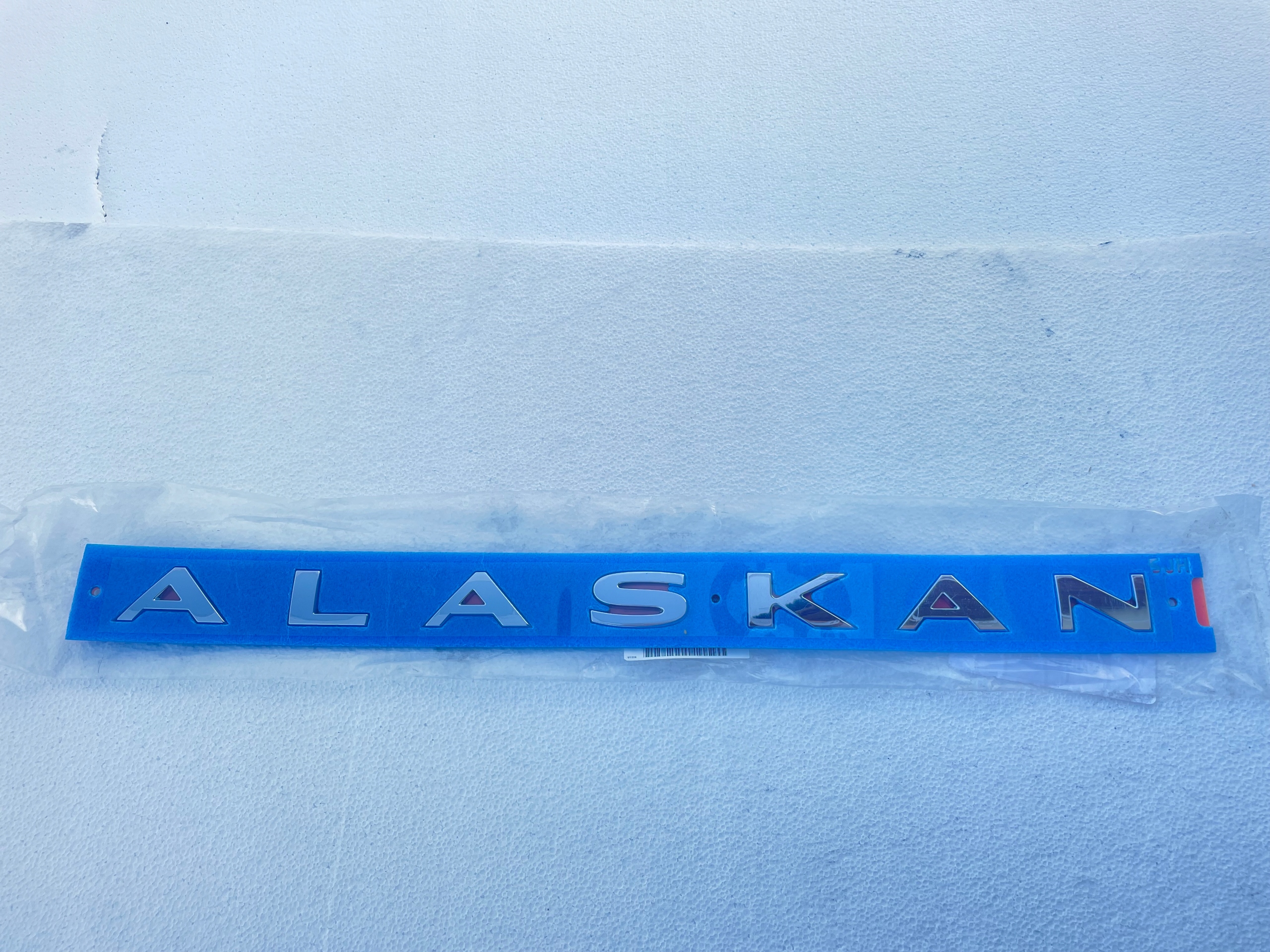 Napis emblemat naklejka Renault ALASKAN Nowy Oryginalny 934955JH0A Marka Renault