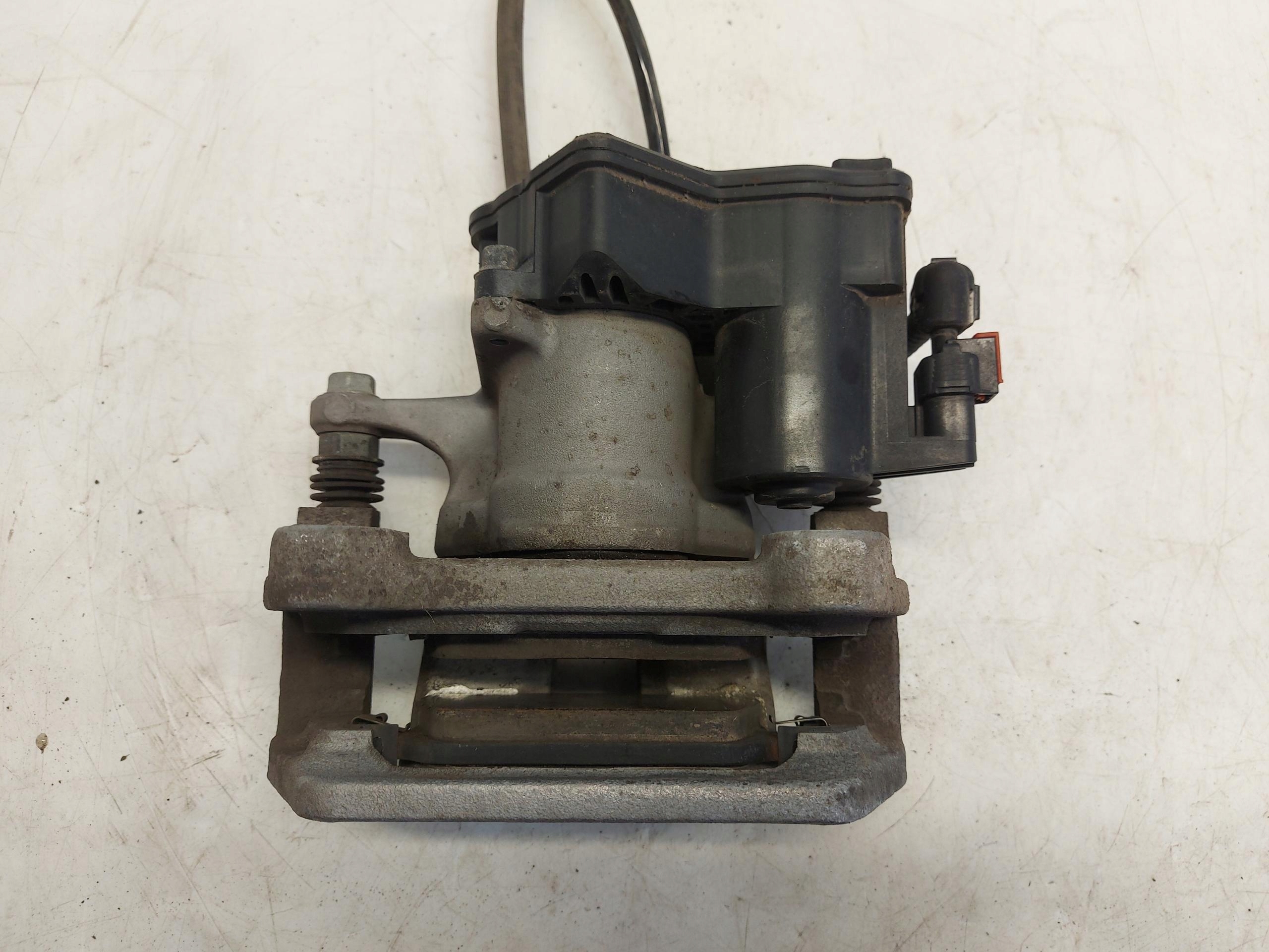 TESLA MODEL Y 2022r caliper jarzmo left left rear part rear. electrical oryg