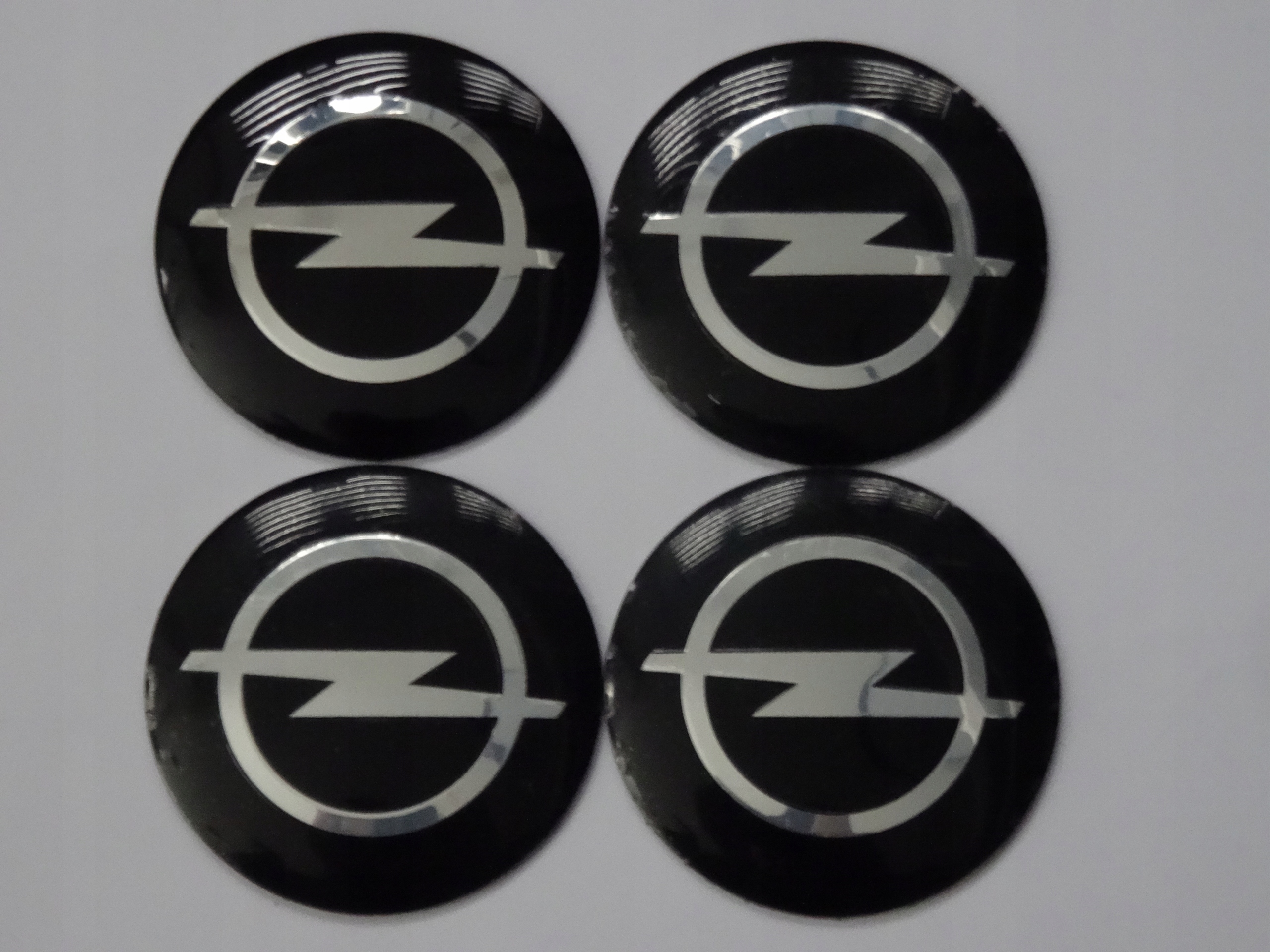

4x Aluminiowe naklejki na dekielki Opel 56mm cz