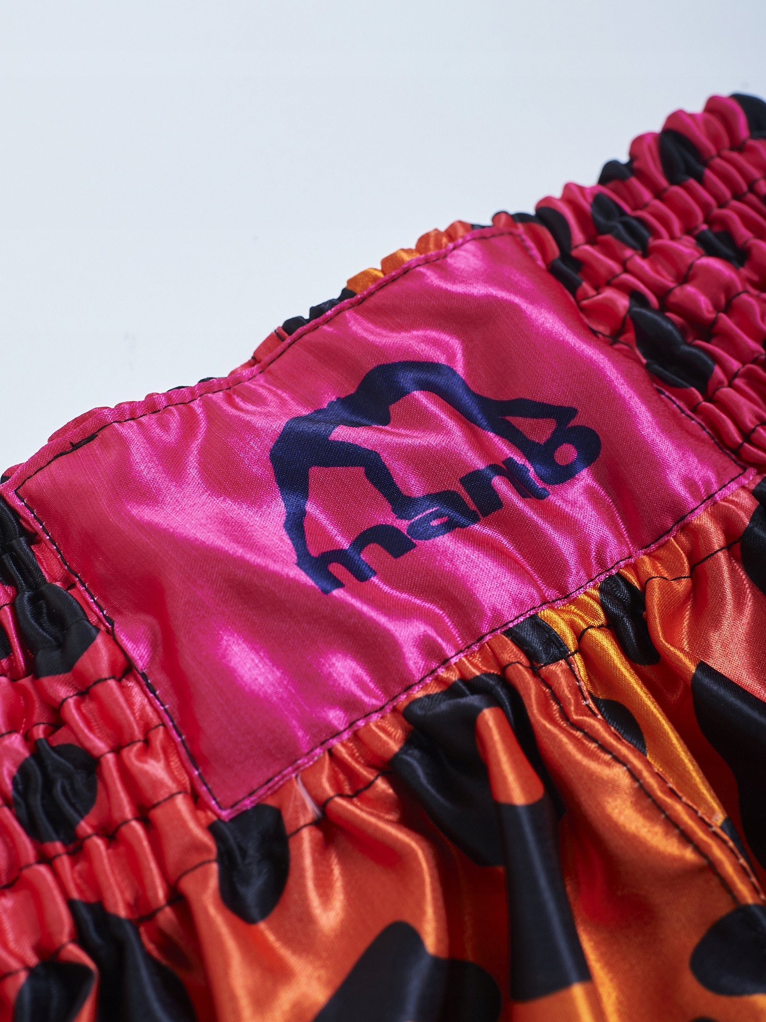 SPODENKI MUAY THAI MANTO LEOPARD Różowe/Pomarańczowe lekka satyna r. M Rozmiar M