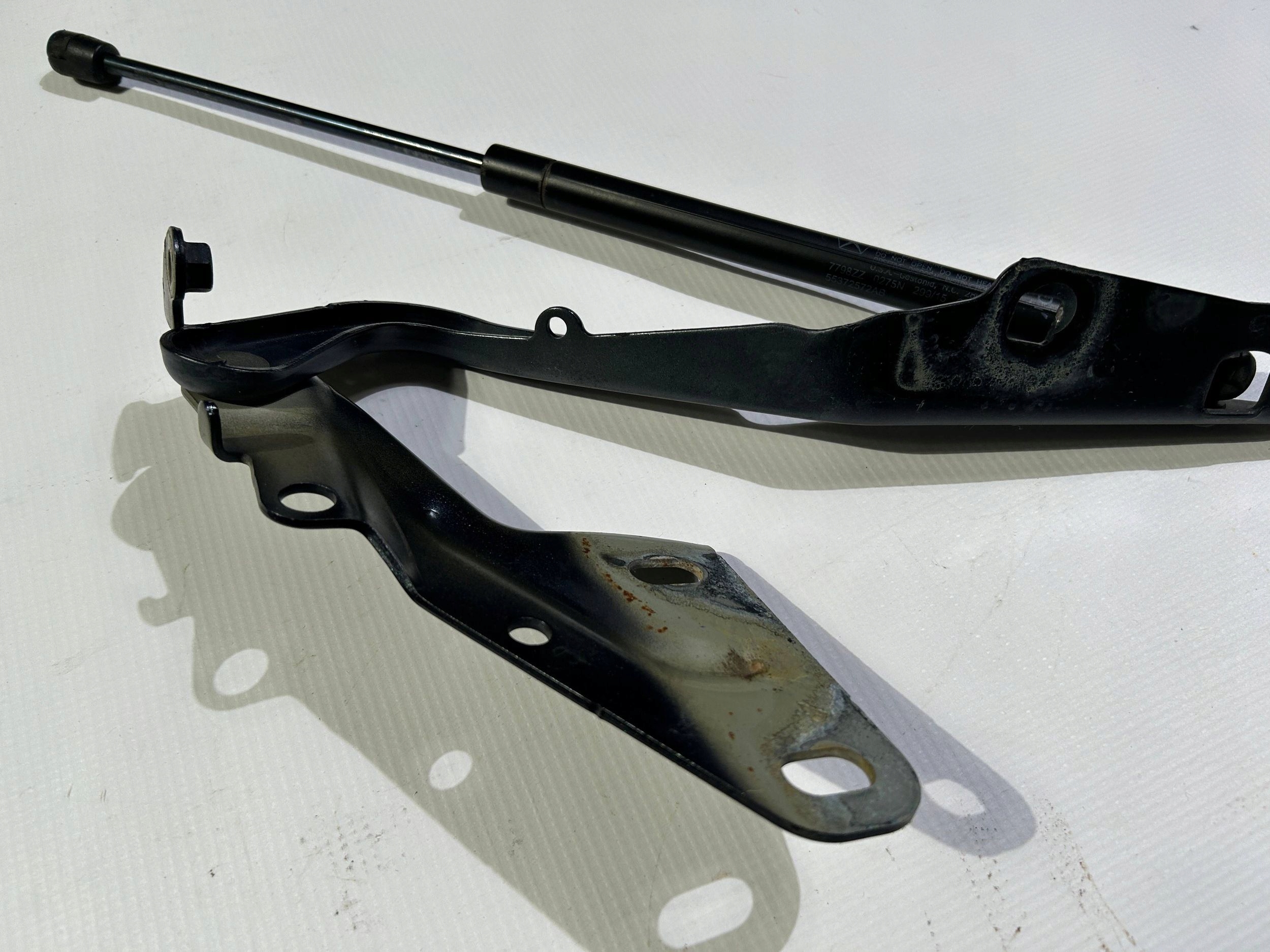hinge bonnets left damper pokrywy of the engine original Dodge RAM 1500 2009