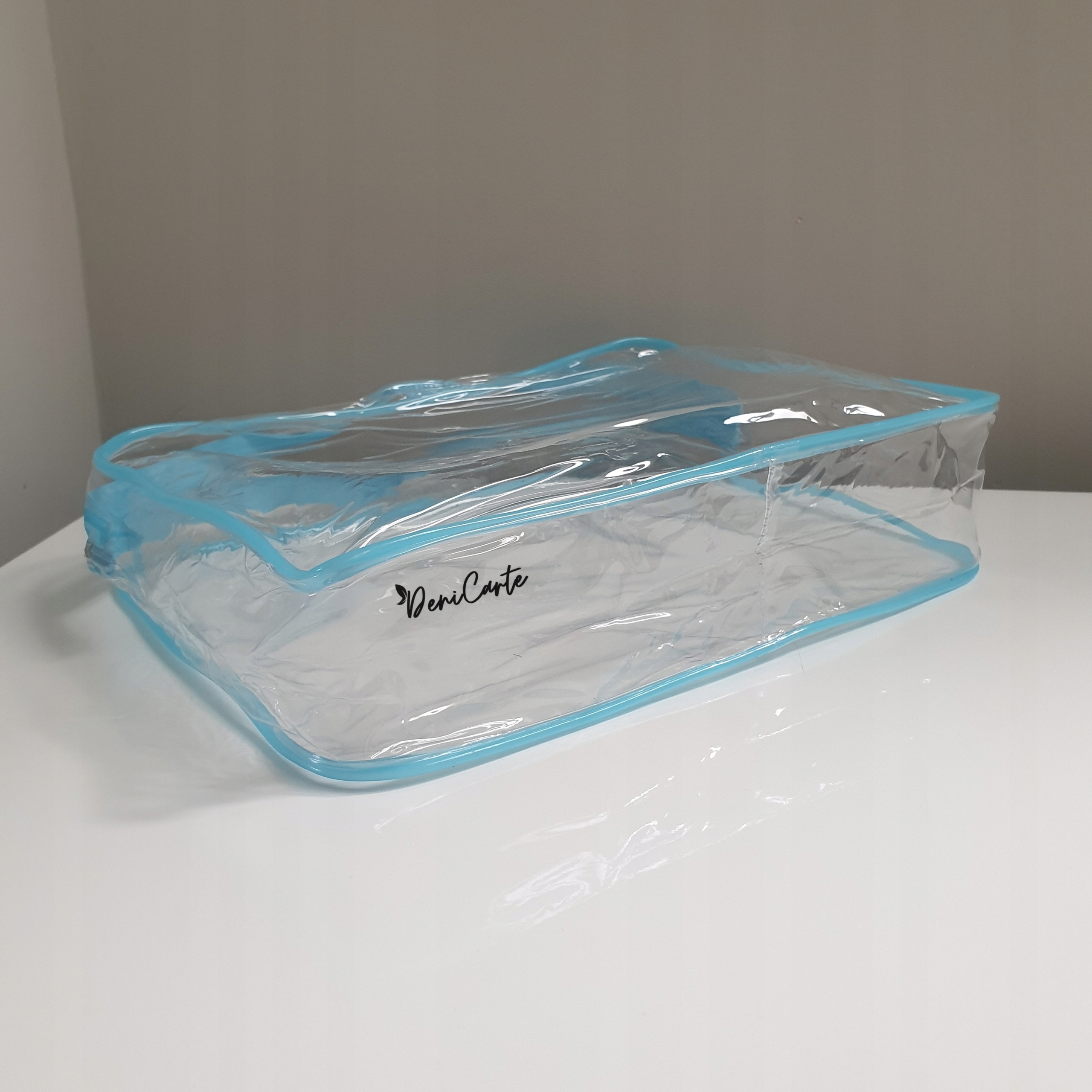 KOSMETYCZKA PRZEŹROCZYSTA POJEMNA PCV WODOODPORNA ORGANIZER DO SAMOLOTU PVC Marka Deni Carte