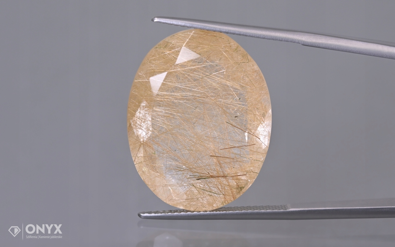 Křemen s rutilem fazetovaný ovál 24,5x19,5 mm