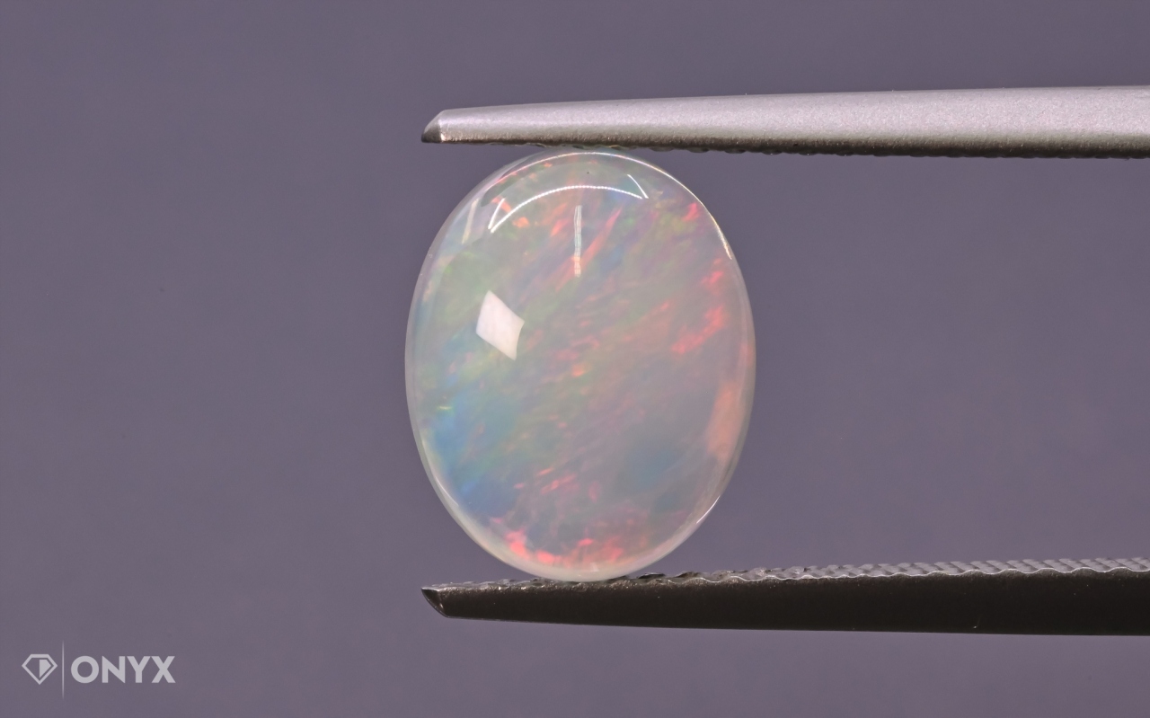 Opál z Etiopie kabošon ovál 10x8 mm