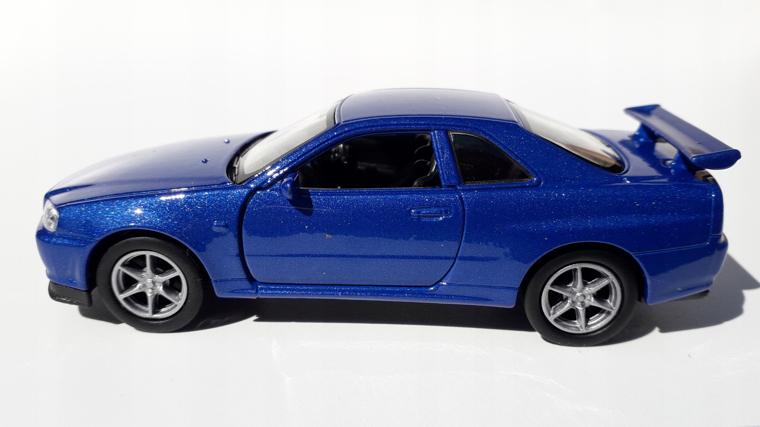 Nissan Skyline GT-R(R34) Niebieski Metalowy Model WELLY 1:34 Bohater brak