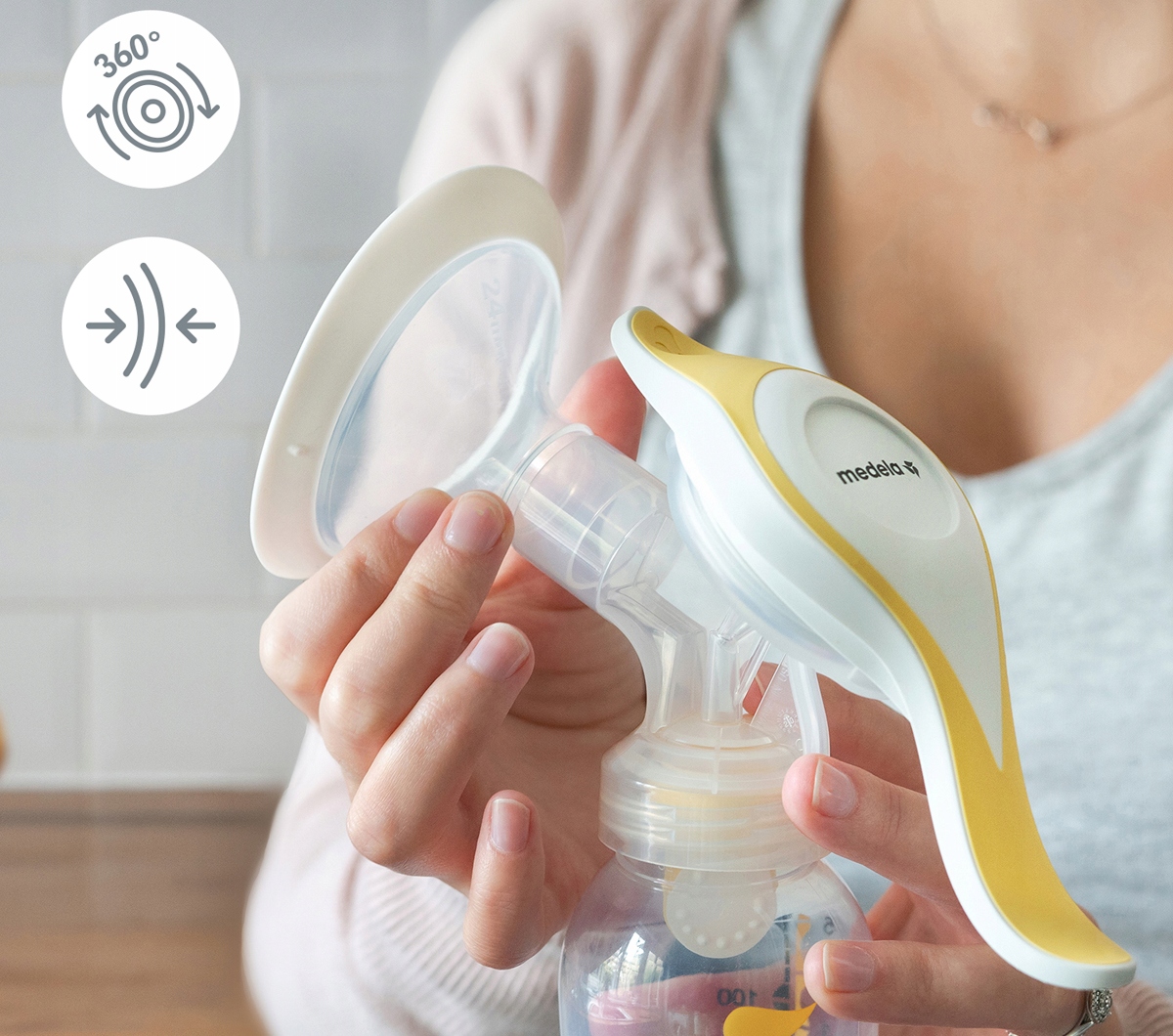 MEDELA HARMONY FLEX LAKTATOR RĘCZNY DWUFAZOWY Elementy zestawu laktator butelka podstawka pod butelkę