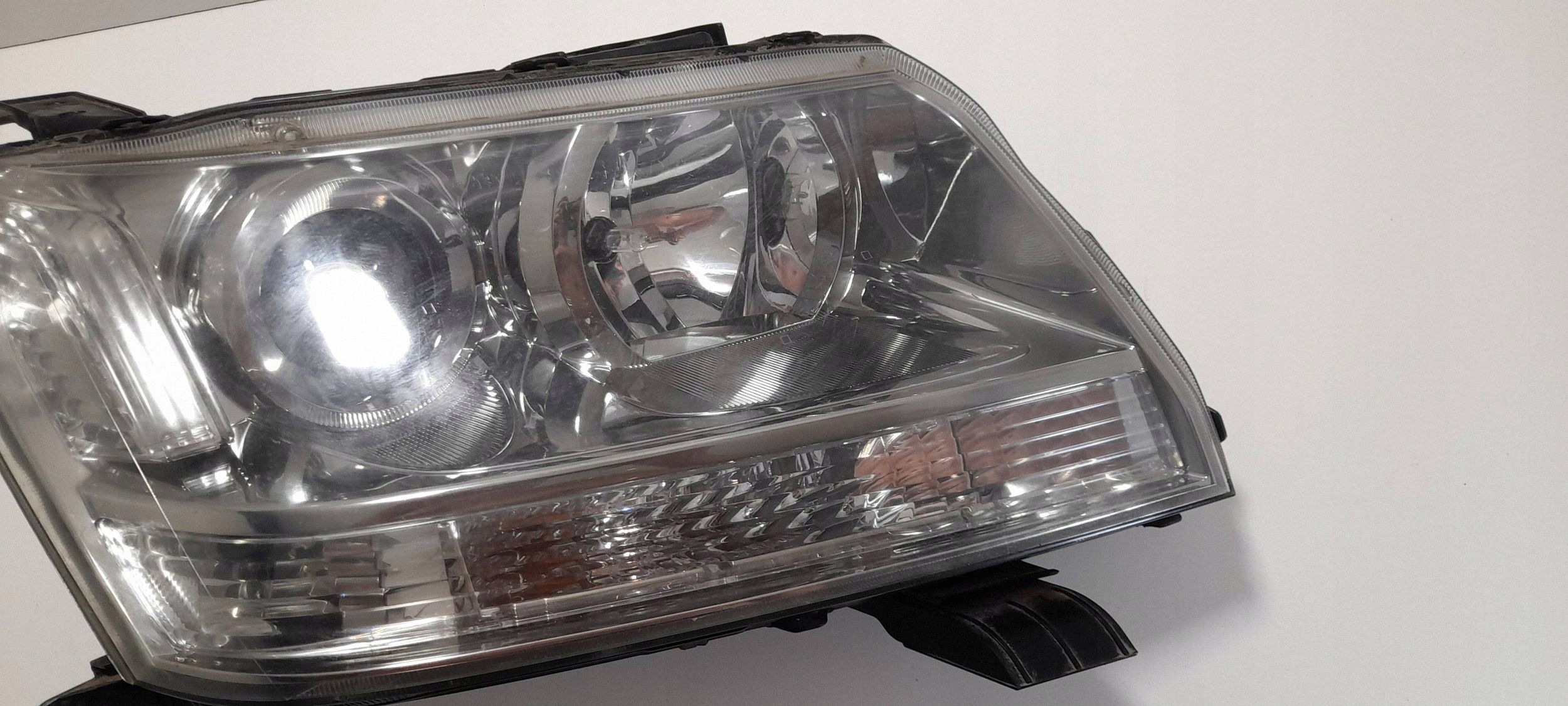 Suzuki Grand Vitara II Reflektor right 10059079 (R463)