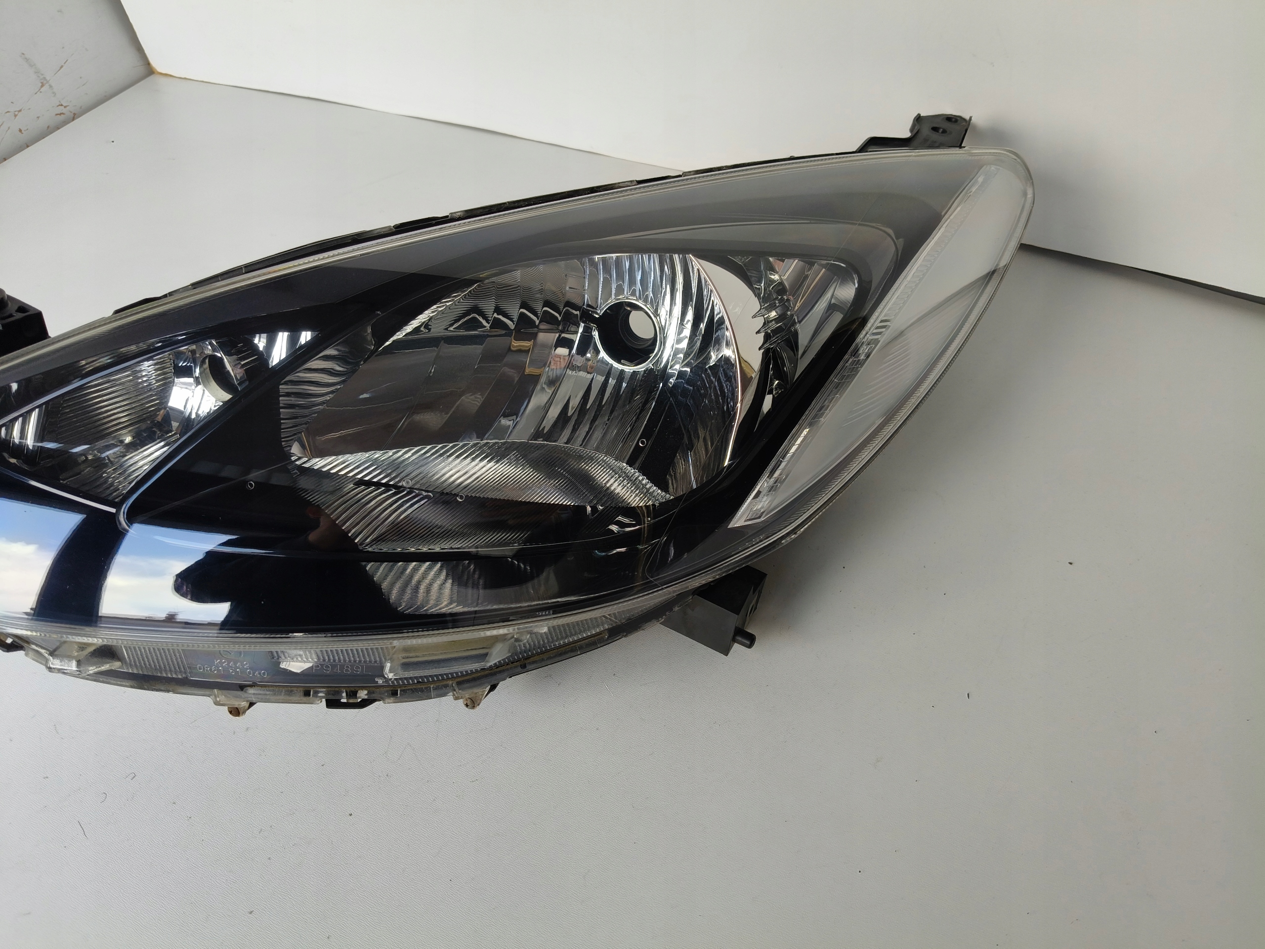 light left REFLEKTOR MAZDA 2 07