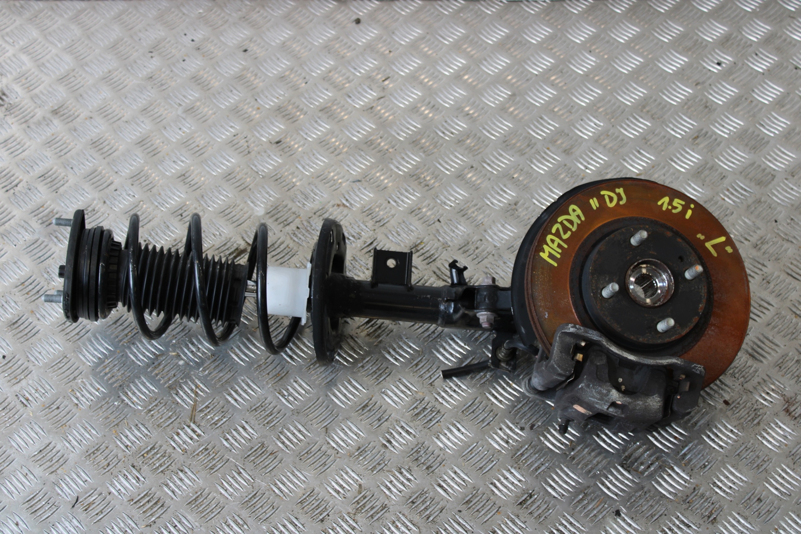 swing shock absorber left front MAZDA 2 II DJ LIFT