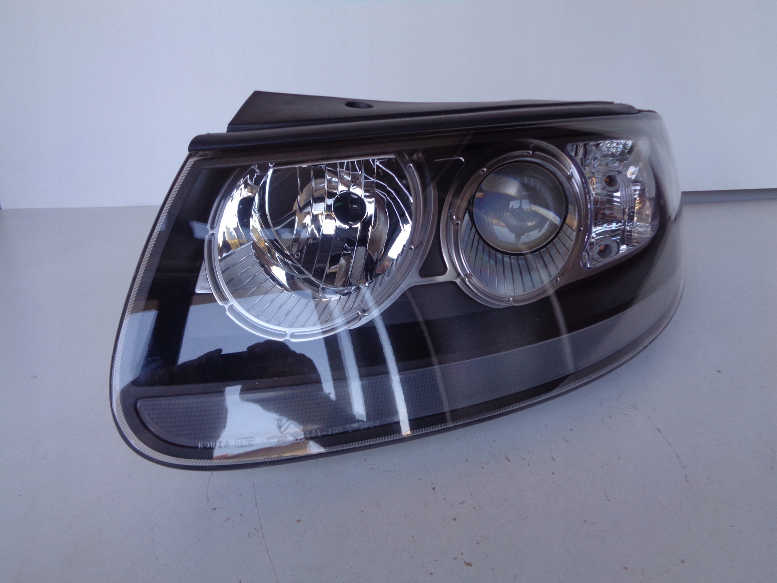 light left REFLEKTOR HYUNDAI SANTA FE II 06