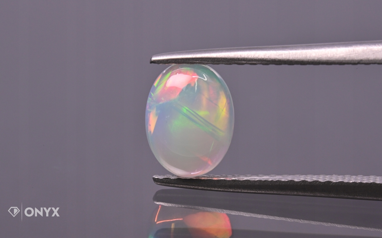 Opál z Etiopie kabošon ovál 8x6 mm