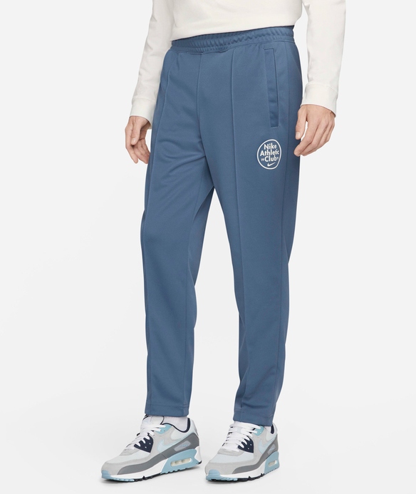 Pánské modré tepláky se zúženým střihem Nike FN5196-491 vel. S