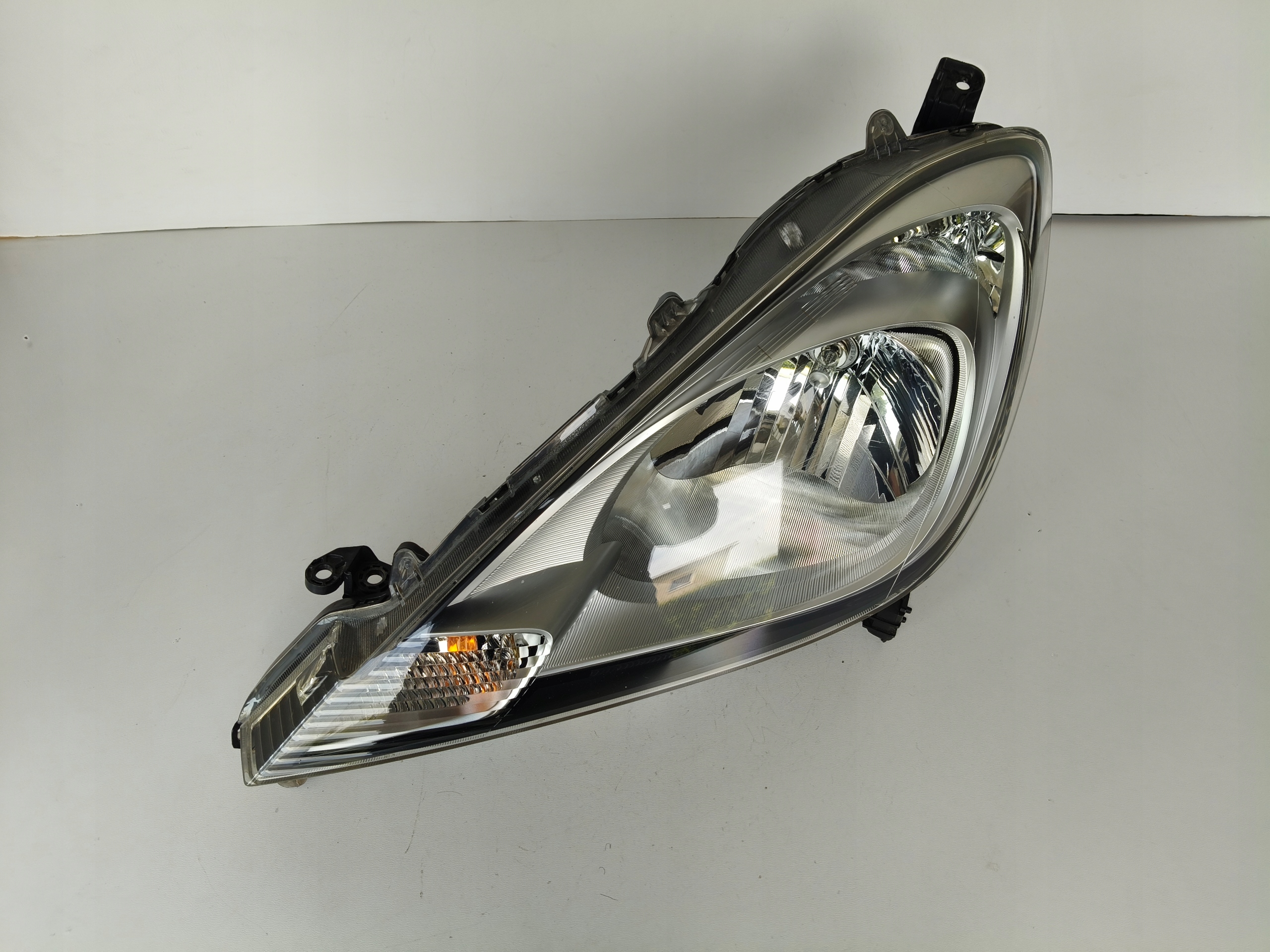 light left REFLEKTOR HONDA JAZZ III 11- LIFT