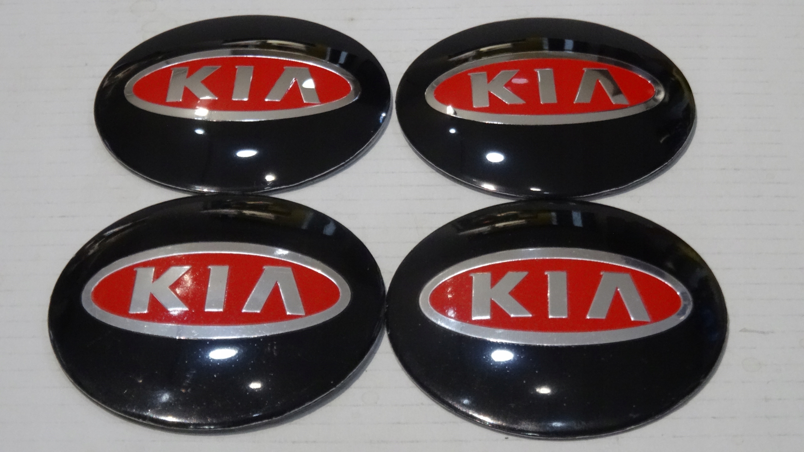 

4x Aluminiowe naklejki na dekielki Kia 56mm czerw
