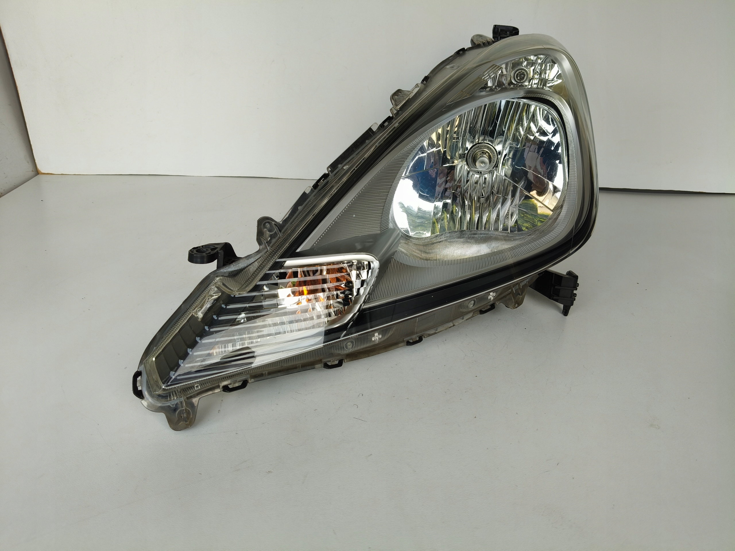 light left REFLEKTOR HONDA JAZZ III 11- LIFT