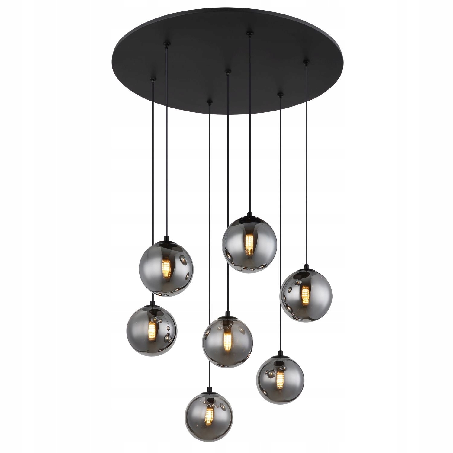 Čierna závesná lampa Riha s teplým leskom nad jedálenským stolom Globo