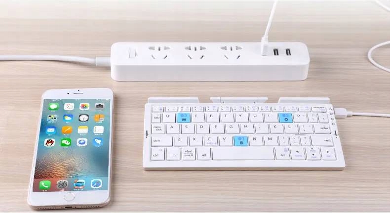 MINI KLAWIATURA SKŁADANA BEZPRZEWODOWA PODSTAWKA NA TELEFON TABLET HIT! Pasuje do modelu Android Ios Windows
