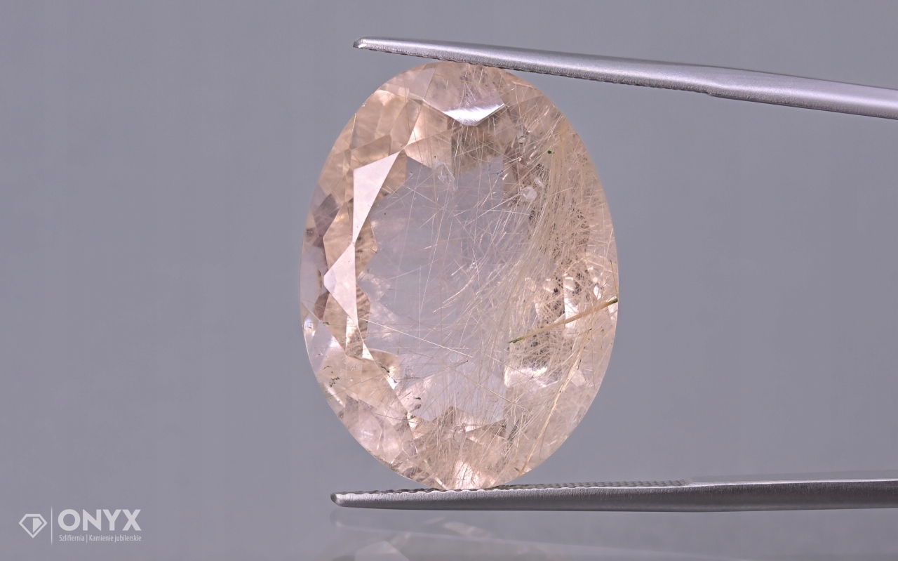 Křemen s rutilem fazetovaný ovál 24,5x18 mm