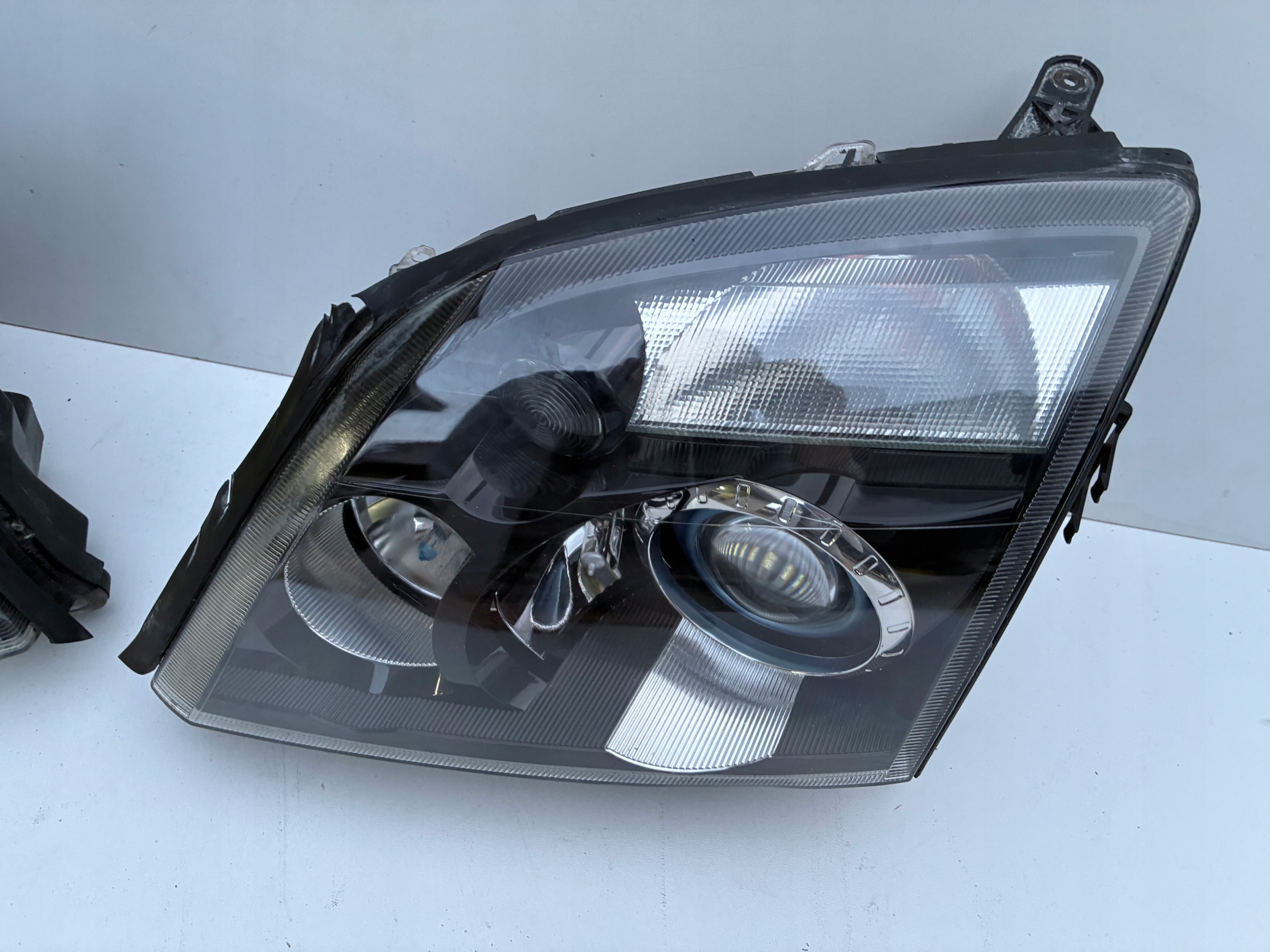 Reflektor light right left front Xenon positioning Opel VECTRA C 02-05r. OEM EU