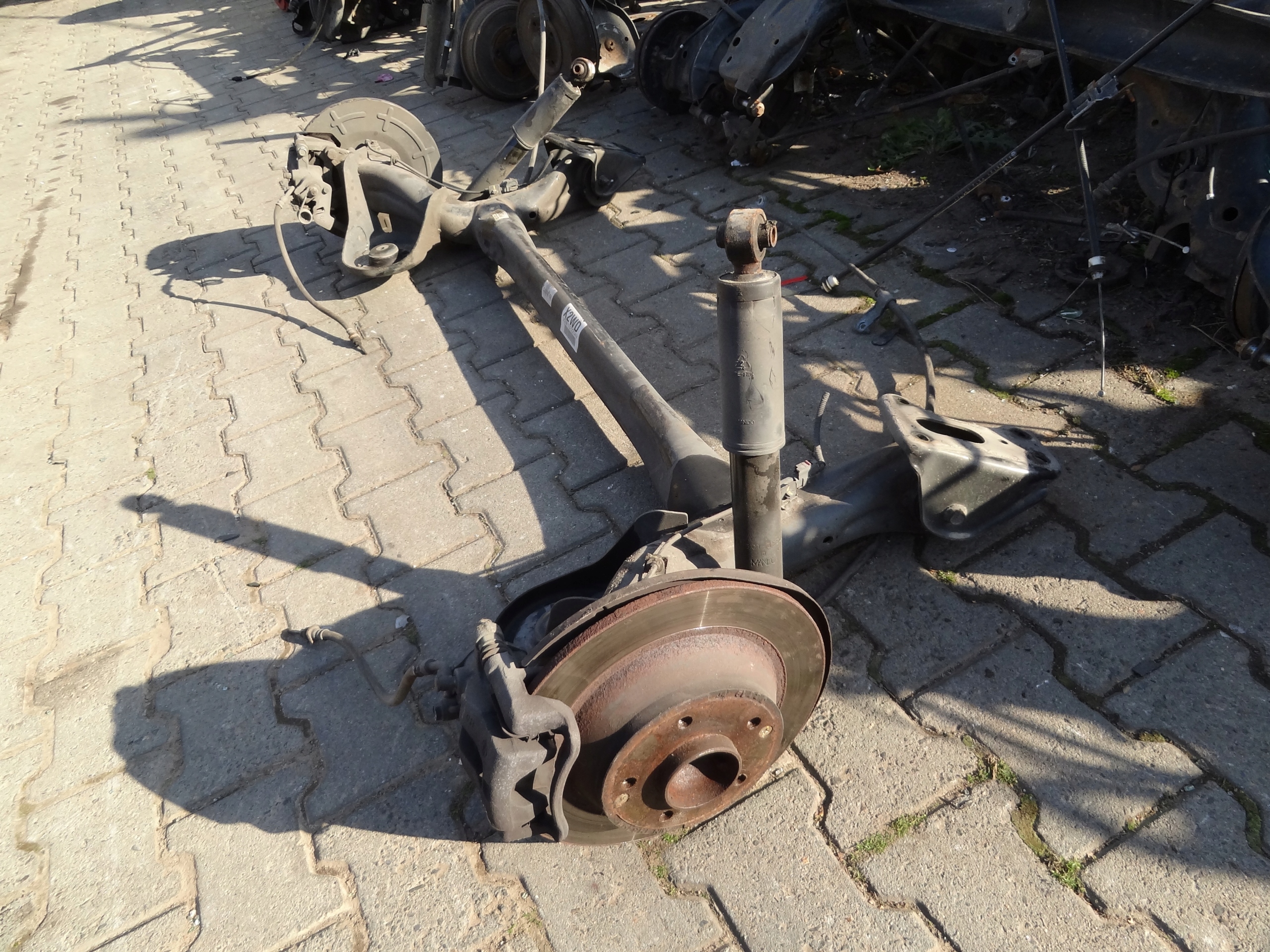 SSANGYONG XLV 2016 BELKA ZAWIESZENIA TYLNA OS KOMPLETNA ORYGINAL