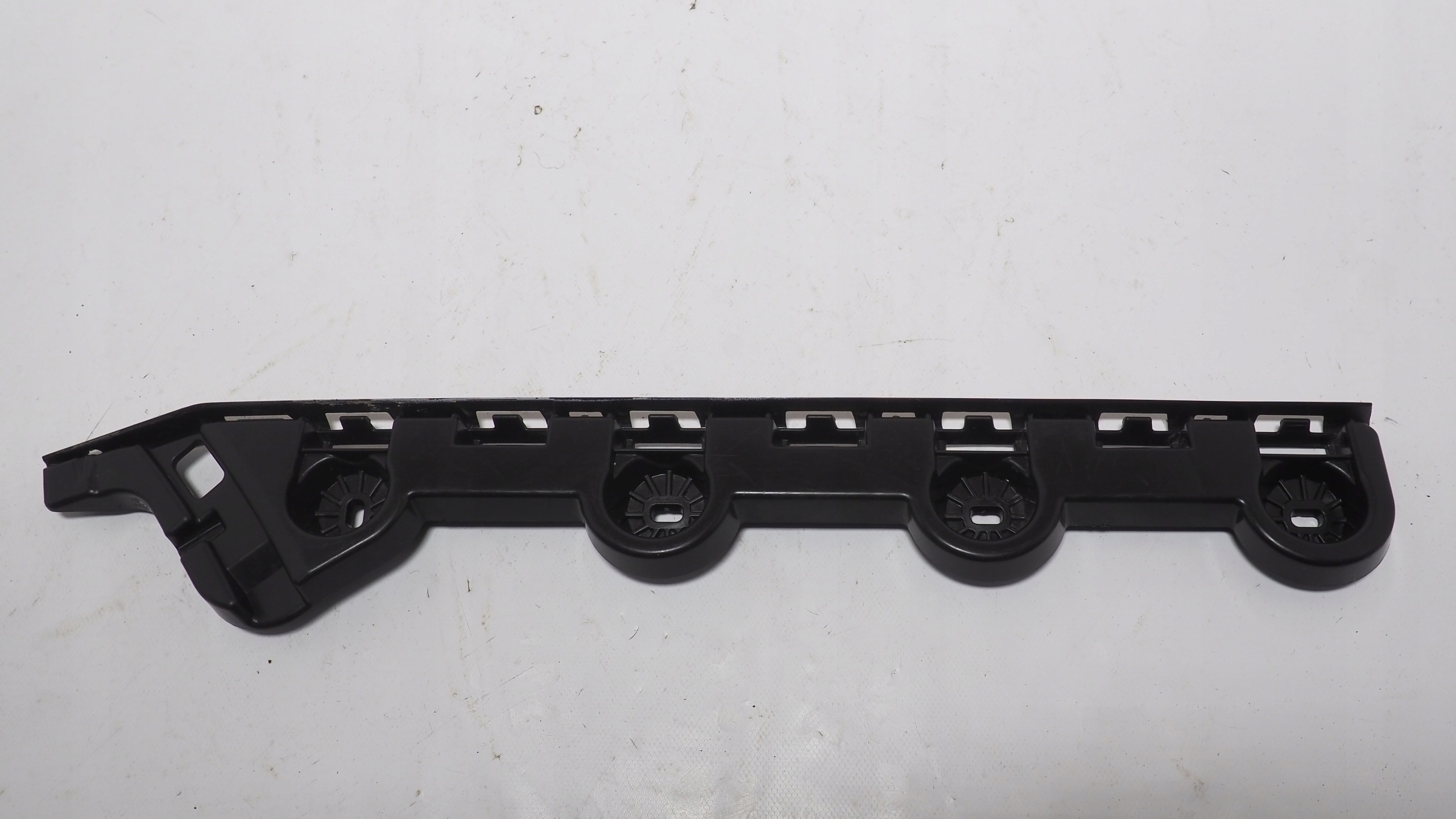 Skoda Octavia IV bumper bracket left rear part