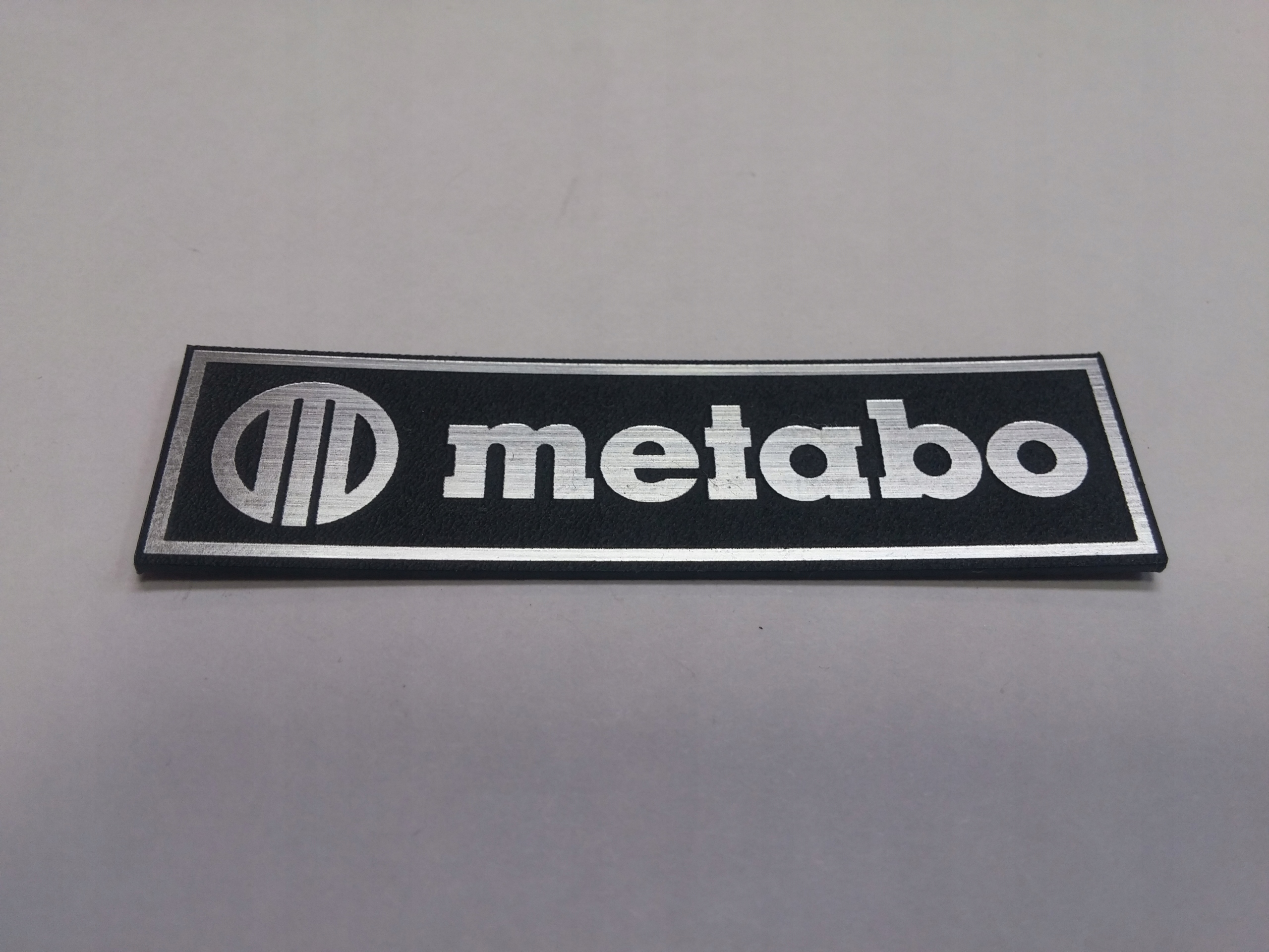 

Metabo naklejka emblemat 118 x 32 mm * Srebrna
