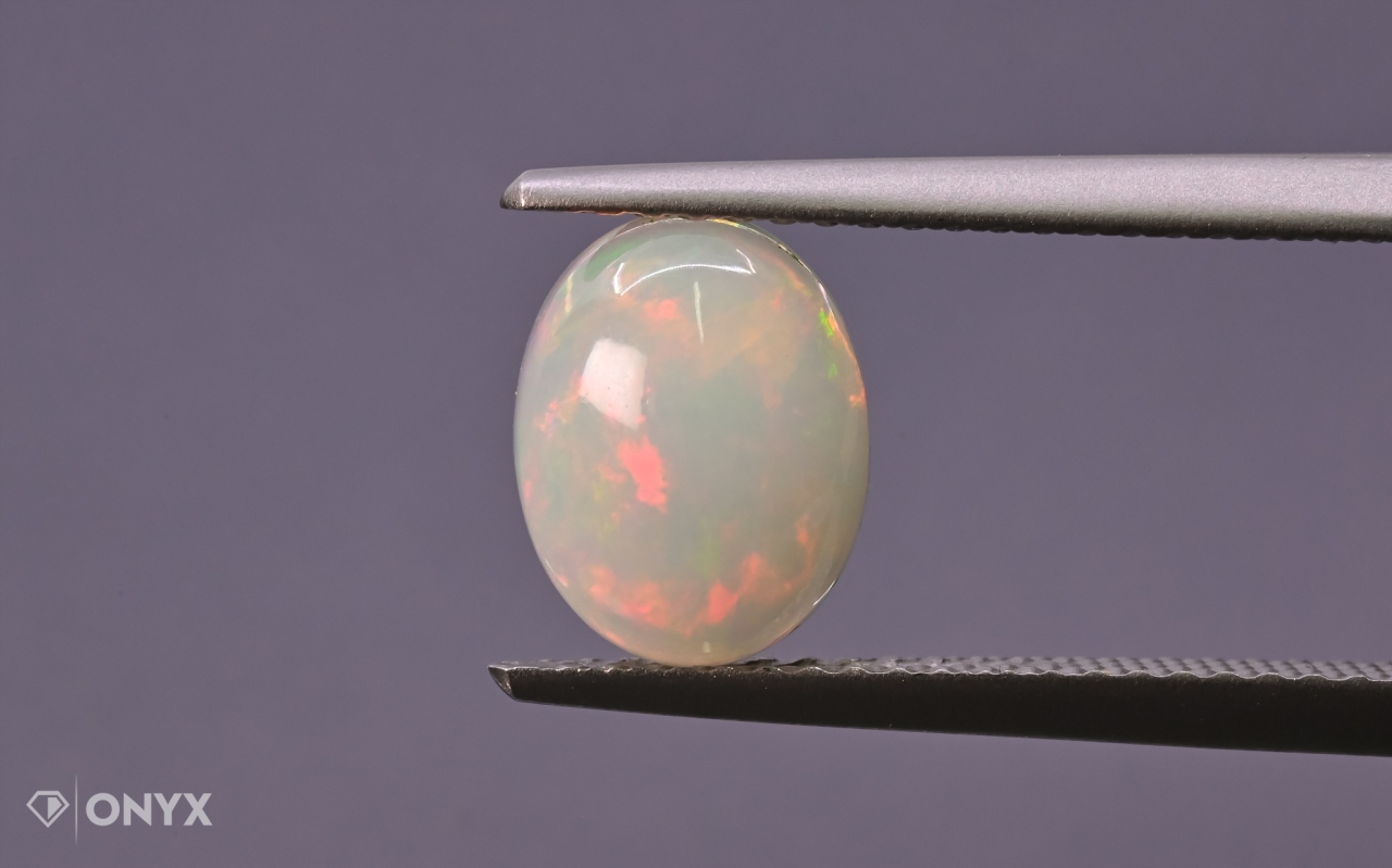 Opál z Etiopie kabošon ovál 9x7 mm