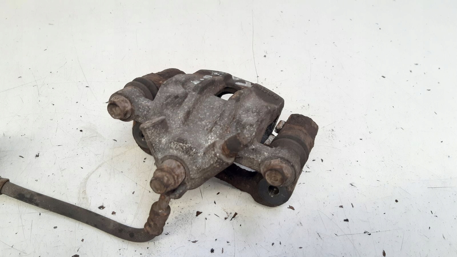 caliper rear part rear left Kia Rio II 1,4