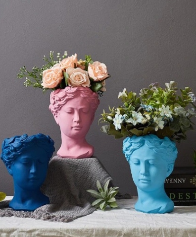 

Doniczka Głowa.H-21cm. Różowy